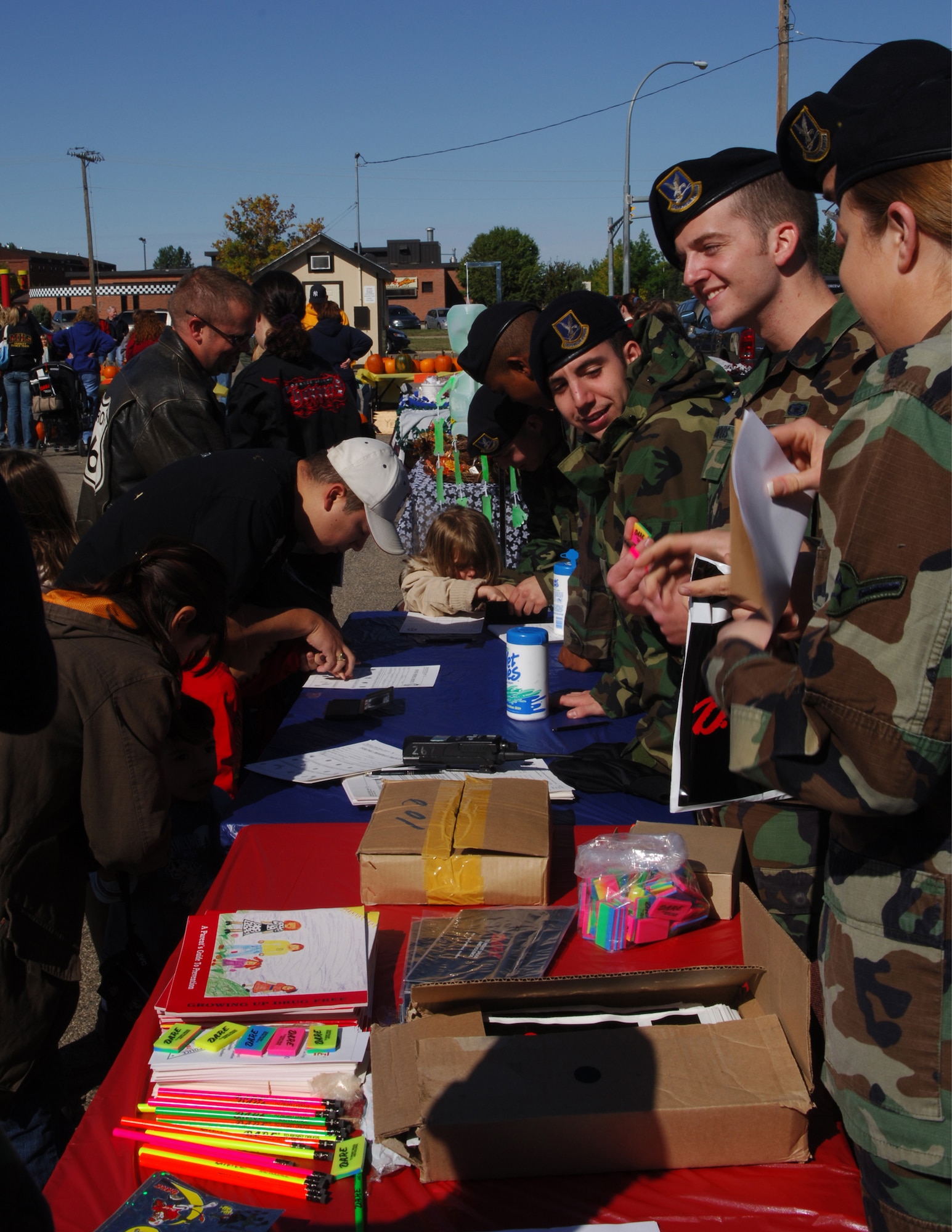 MINOT AIR FORCE BASE, N.D. -- Members from the 5th Security Forces Squadron take fingerprints and promote the Drug Abuse Resistance Education Program here during  fall festival Sept. 23. The fall festival is an annual base event to kick-start the fall season. (U.S. Air Force photo by Airman 1st Class Joe Rivera) 