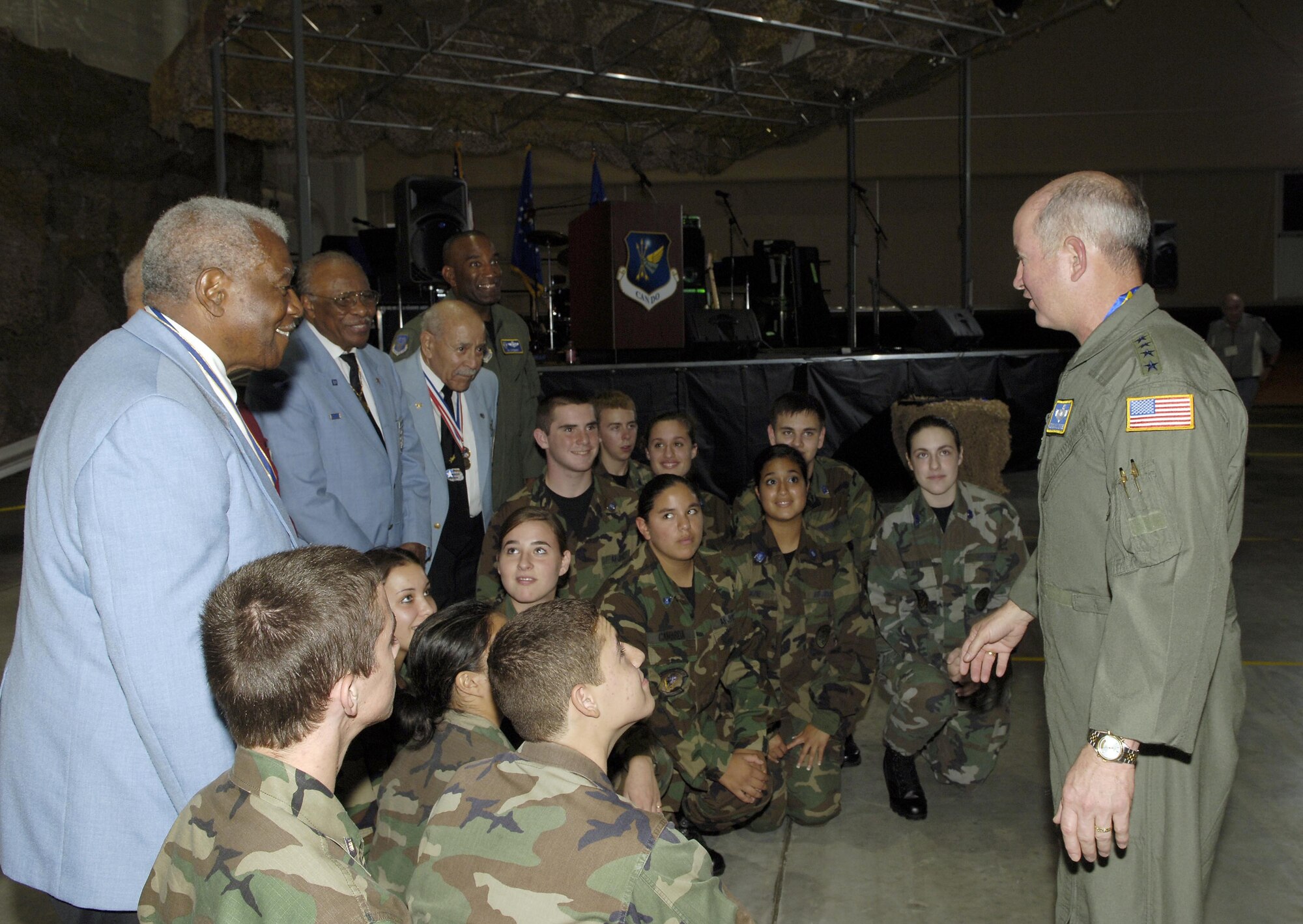 MCGUIRE AFB, N.J. -- Gen. Duncan J. McNabb, Air Mobility Command commander tells Reserve Junior Officer Training Corp cadets from Old Bridge High School, Old Bridge, N.J., about the Tuskegee Airmen before a group picture is taken with four original members. General McNabb was guest speaker at the Air Force birthday celebration held Saturday at McGuire Air Force Base, N.J. USAF photo by Kenn Mann.