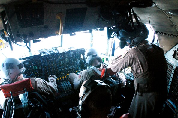 Crewmembers monitor flight operations from the front deck of a C-130 Hercules while transporting Soldiers to Balad Air Base, Iraq. The Hercules crew is assigned to the 386th Air Expeditionary Wing. (U.S. Army photo/Spc. Chris Jones)