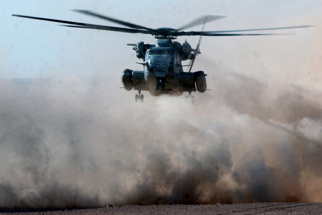 On September 27, 2006 a CH-53E of Heavy Marine Helicopter Squadron 361 lands to conserve fuel after its first initial attempt to externally lift a UH-60 Black Hawk Helicopter of 82nd Medical Battalion after it hit a land mine on September 25, 2006 near Al Asad, Iraq. 3D MAW is currently deployed with First Marine Expeditionary Force (Forward) in support of Operation Iraqi Freedom in the Al Anbar Province of Iraq (Multi National Forces- West) to develop the Iraqi Security Forces, facilitate the development of official rule of law through democratic government reforms, and continue the development of a market based economy centered on Iraqi reconstruction. 060927-M-3988H-027 (U.S Marine Corps photo by Corporal Richard A Hilario)