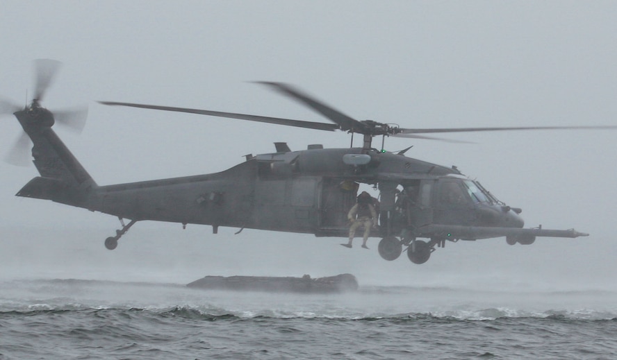 Moody rescue crews test the “Kangaroo Duck” concept recently in the Gulf of Mexico off the coast of Apalachicola, Fla. K-Duck is designed to improve the wing’s capabilities when faced with water-rescue scenarios and involves strapping an inflatable rubber raft to the underbelly of an HH-60G Pave Hawk. (Courtesy Photo)