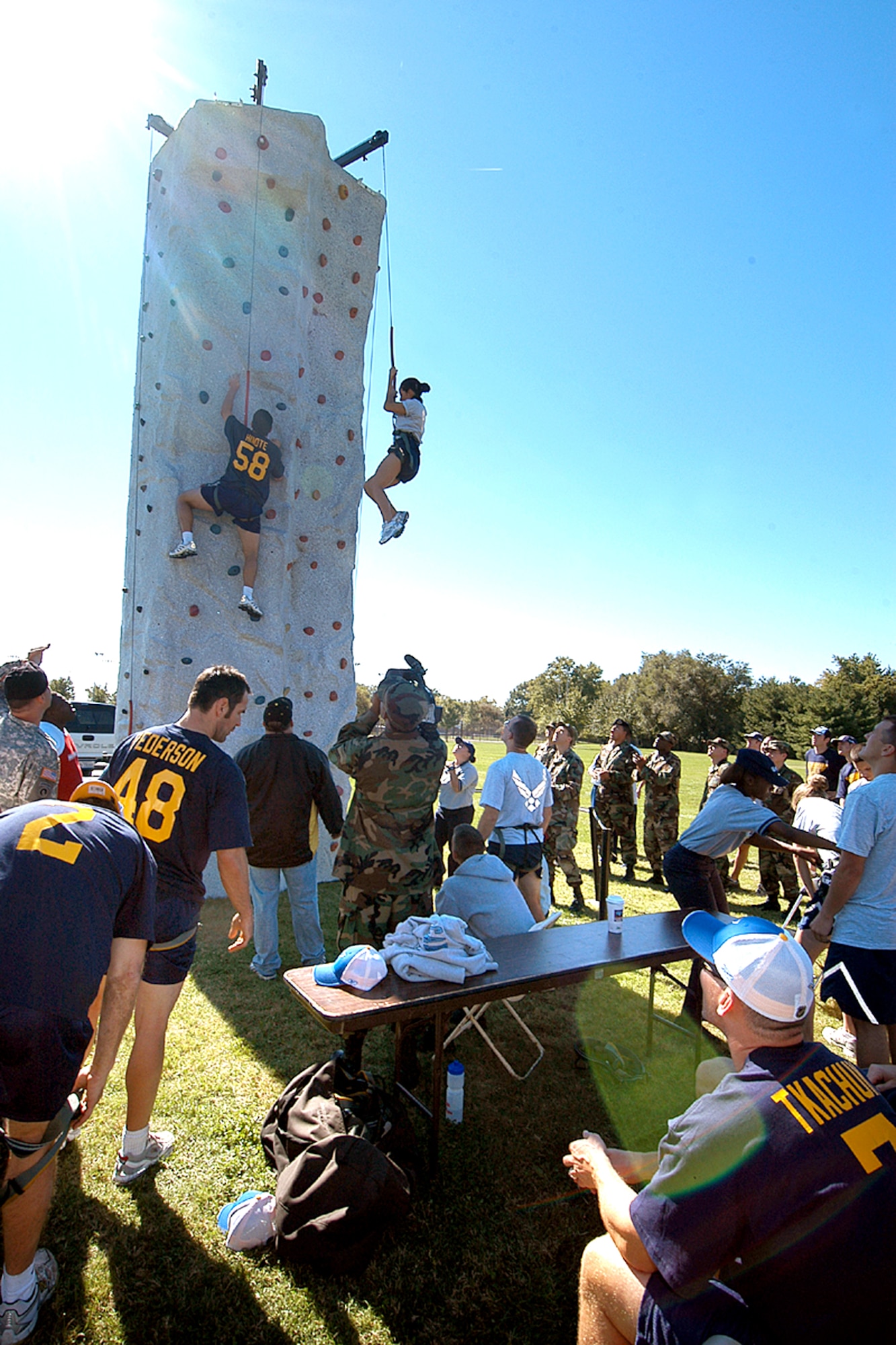 Members of the St. Louis Blues hockey team compete with Airmen on the climbing wall as part of team building and leadership field exercises at Scott Air Force Base, Ill., Sept. 26. (U.S. Air Force photo/Marvin Lynchard) 

