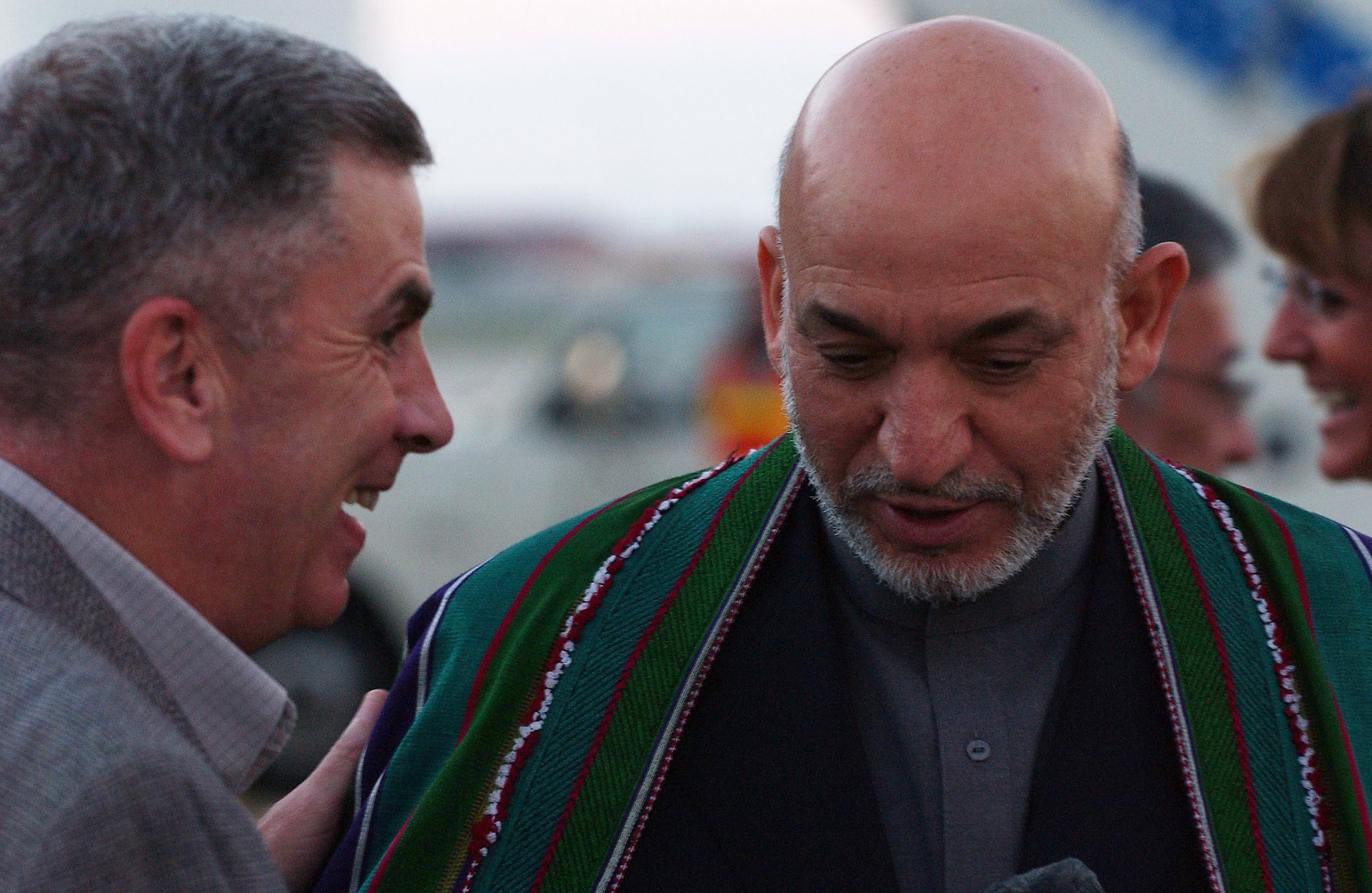 Afghanistan's President Hamid Karzai (right) talks with Army Gen. John Abizaid Sept. 26 shortly after landing at MacDill Air Force Base in Tampa, Fla. President Karzai visited with General Abizaid, the commander of United States Central Command, during his visit to the United States this week. (U.S. Air Force photo/Senior Airman Jason Robertson)

