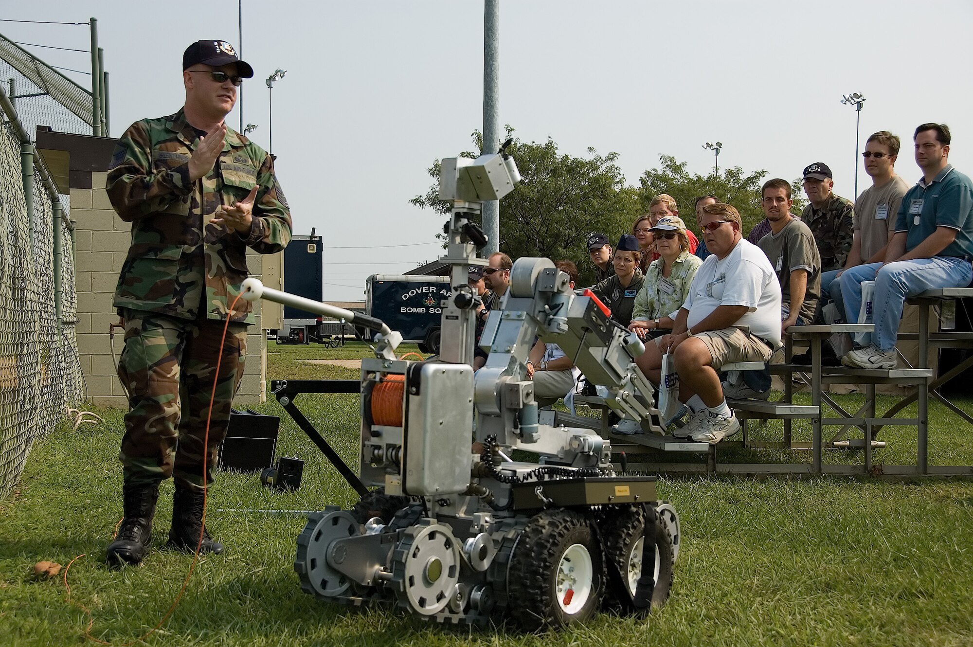 Master Sgt. Dave Guenthner, Explosive Ordnance Disposal, explains his job to more than 30 employers during the 512th Airlift Wing Employer Appreciation Day Sept. 9 at Dover Air Force Base, Del. The annual event gives employers the opportunity to experience Reserve life up close and in person. The 512th AW has more than 1,700 reservists assigned. Without the support of their employers, reservists would not be able to train and deploy to accomplish the Air Force?s vital role in the U.S. military. As part of the day, employers were ?mobilized,? and processed for a mock deployment through a simulated mobility line. They also received a tour of the base and an orientation flight on a C-5 Galaxy.