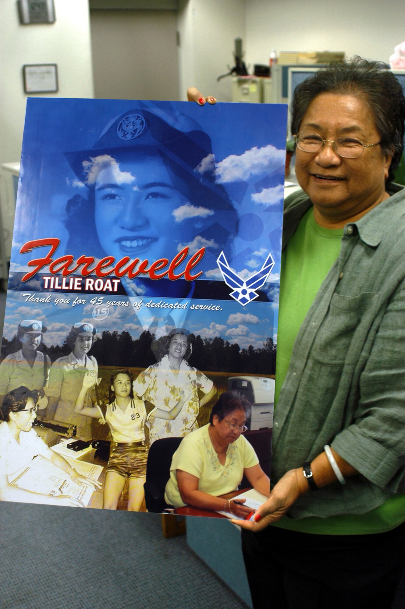 Mrs. Tillie Roat, 301st Fighter Wing budget manager, displays the collage depicting nearly half a century of her life with the military.