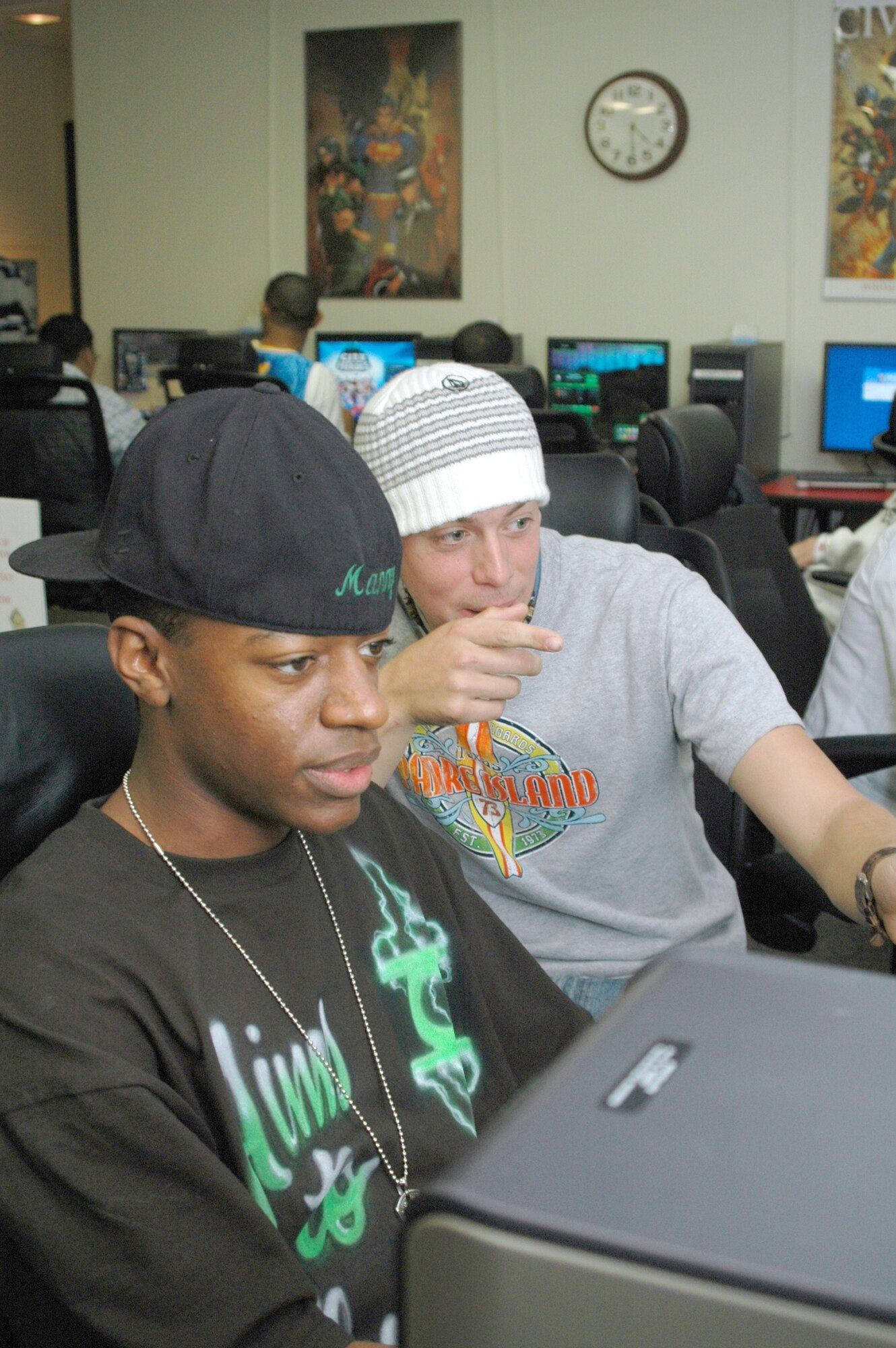 Airman Manny Simmons and Airman 1st Class Nate Patterson use Internet in The Detour's game room. 