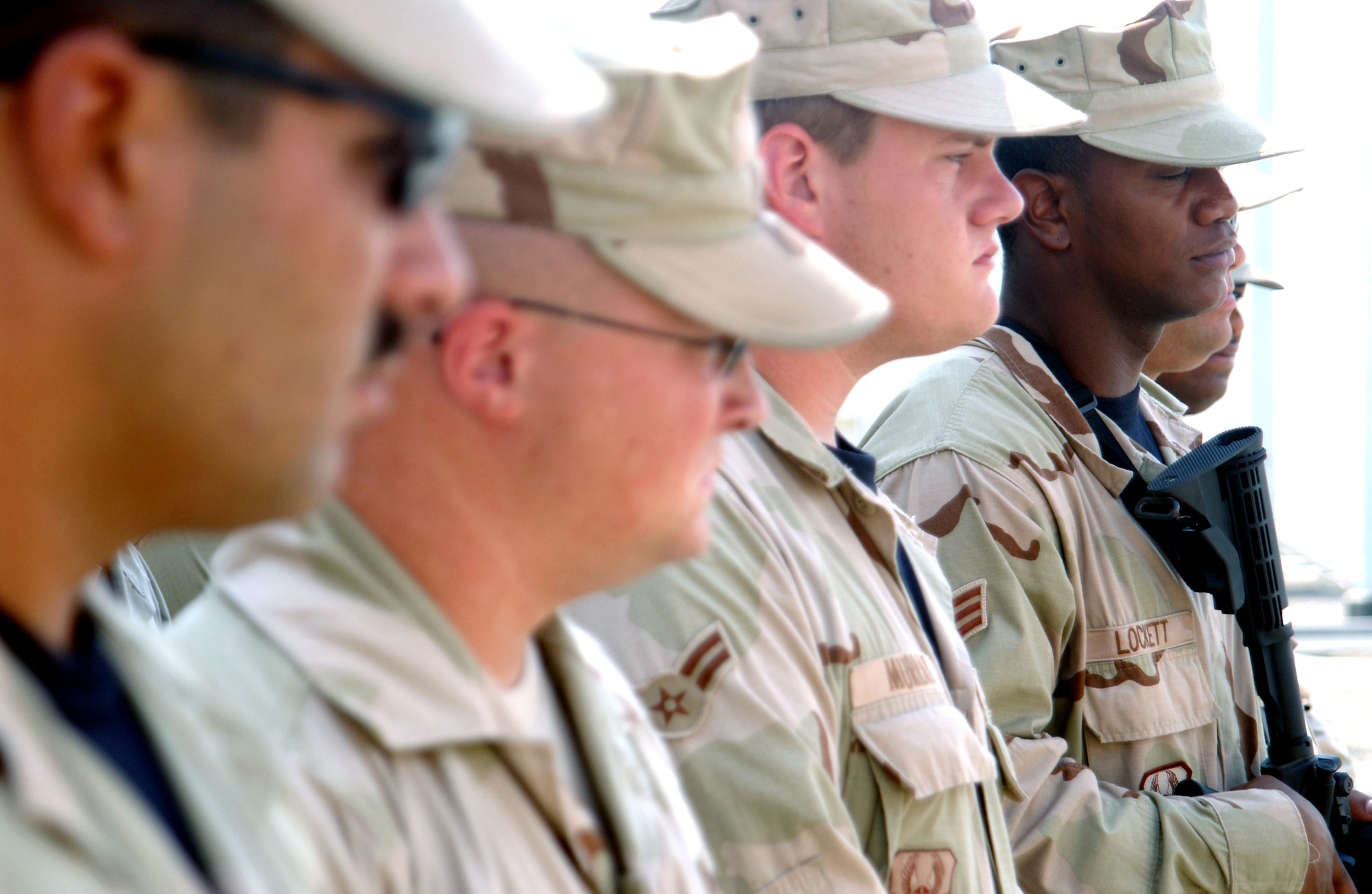 Airmen from the 380th Expeditionary Security Forces Squadron listen to orders from their flight chief during a "guard mount" Sept. 28 at a forward-operating base in Southwest Asia. About 200 security forces are deployed to this location defending the people and assets of the 380th Air Expeditionary Wing. (U.S. Air Force photo/Master Sgt. Jason Tudor)
