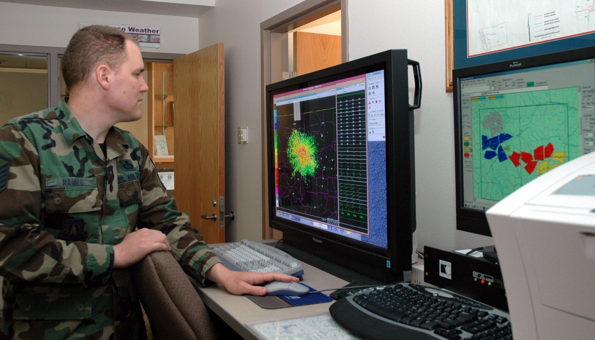 Master Sgt. Troy Rames, NCOIC of the Combat Weather Team, checks the radar screen for developing weather in the local area.