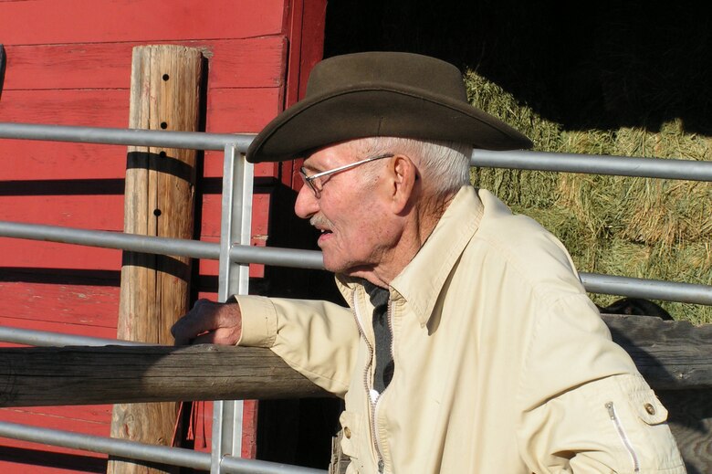 Eighty-three-year-old Walter Henley peers throught the fence at his horse, Big Buck, who is housed a the Malmstrom stables. Besides being a veteran of three wars, Mr. Henley is a trusted advisor to many members of the Big Sky Riders Saddle Club.