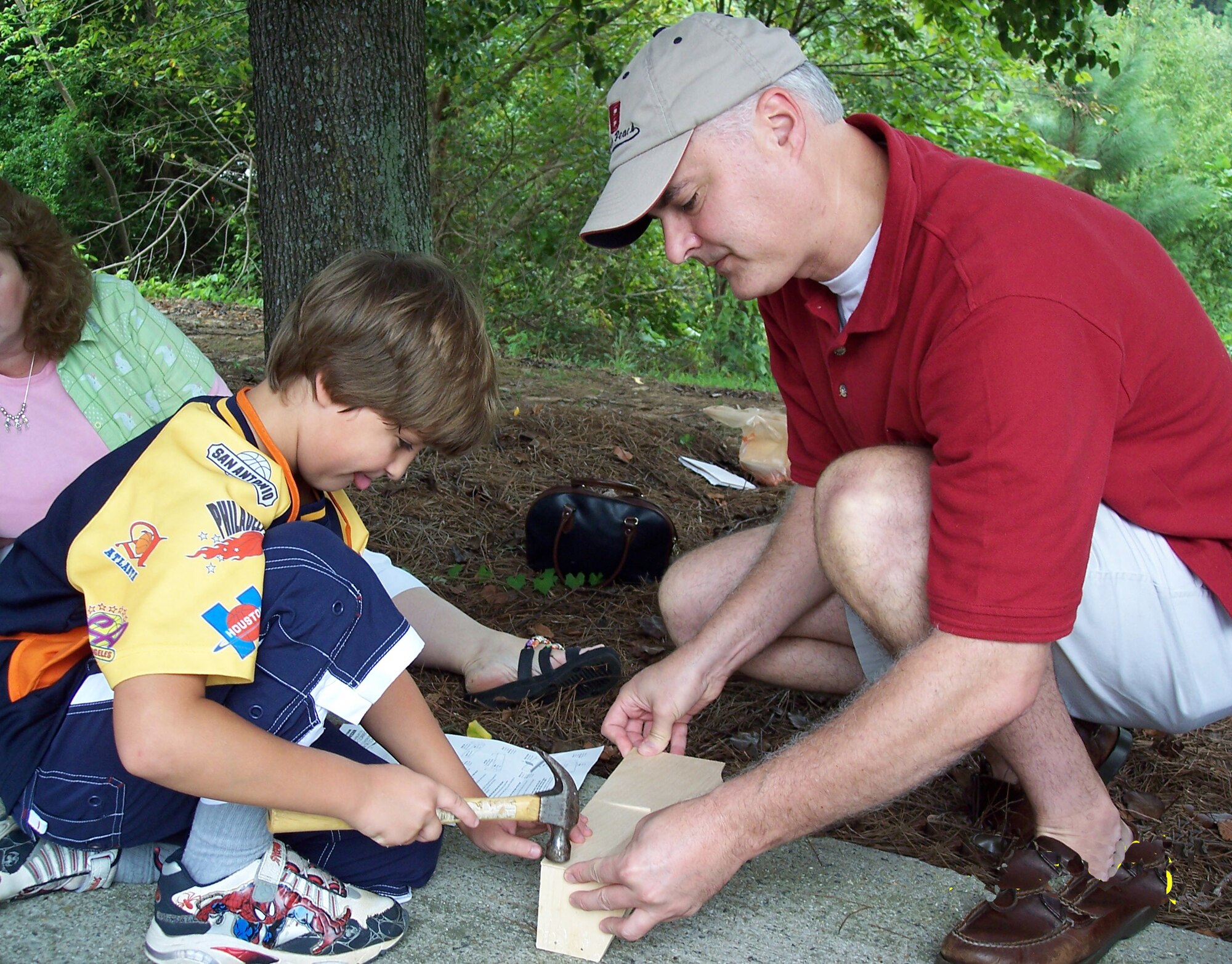 Senior Master Sergeant Steve Winn, 622nd Regional Support Group logistics planner and his son Spencer, 10, built a toy organizer during family day.