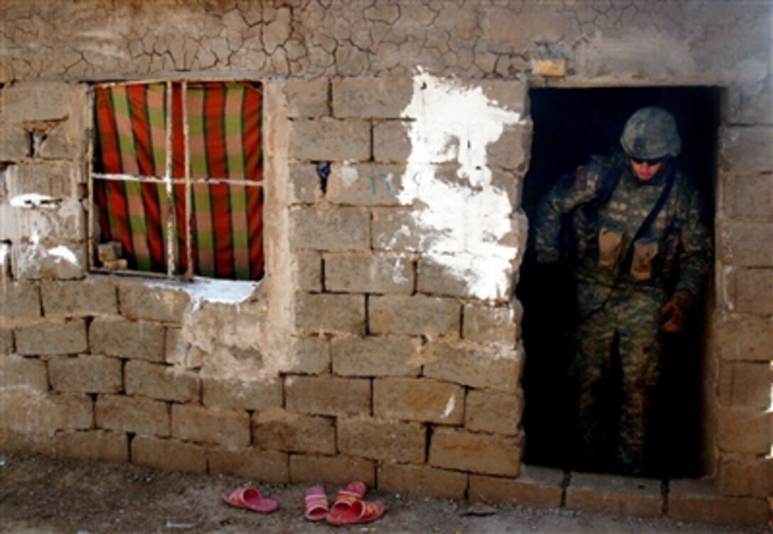 U.S. Army soldiers search a home in Baghdad, Iraq, Sept. 24, 2006.   The soldiers are from Charlie Company, 1st Battalion, 17th Infantry Regiment, 172nd Stryker Brigade Combat Team, 4th Infantry Division.