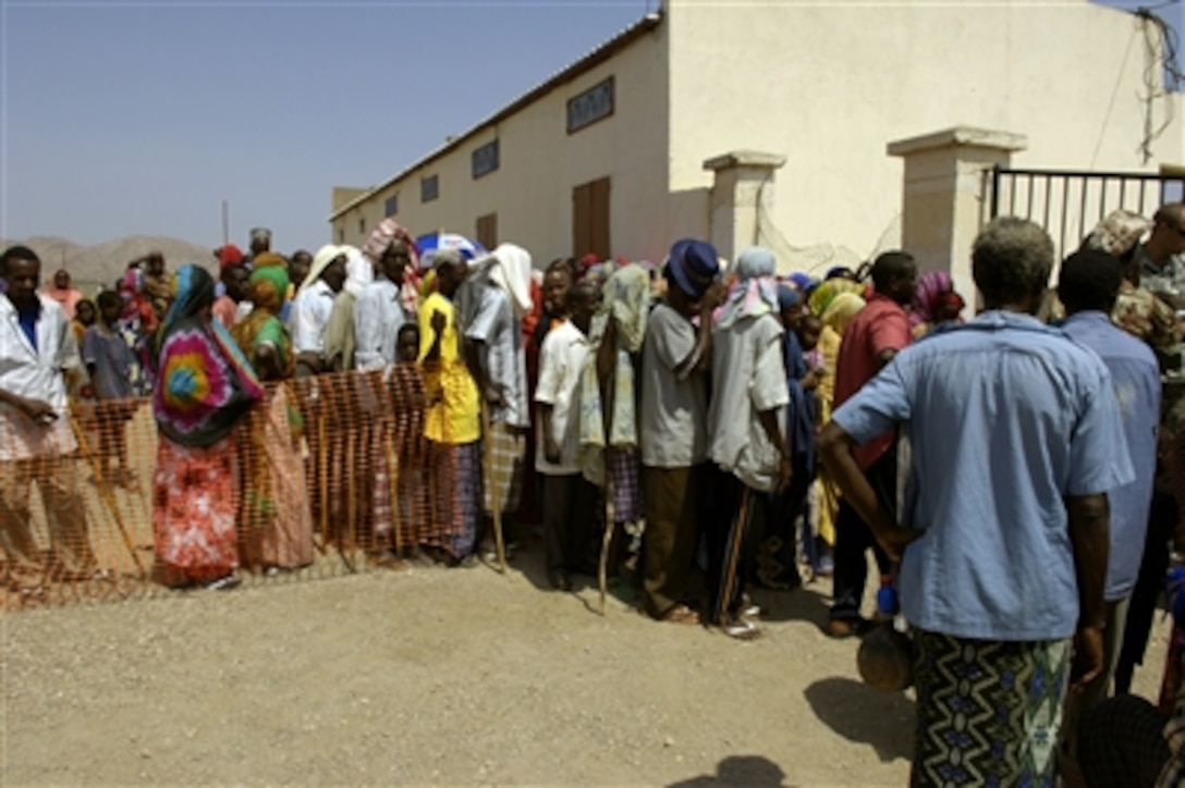Djiboutian villagers line up outside a school to be seen by U.S. medical personnel during a medical civic action program in Ali Adde, Djibouti, Sept. 20, 2006, in support of Combined Joint Task Force - Horn of Africa. 