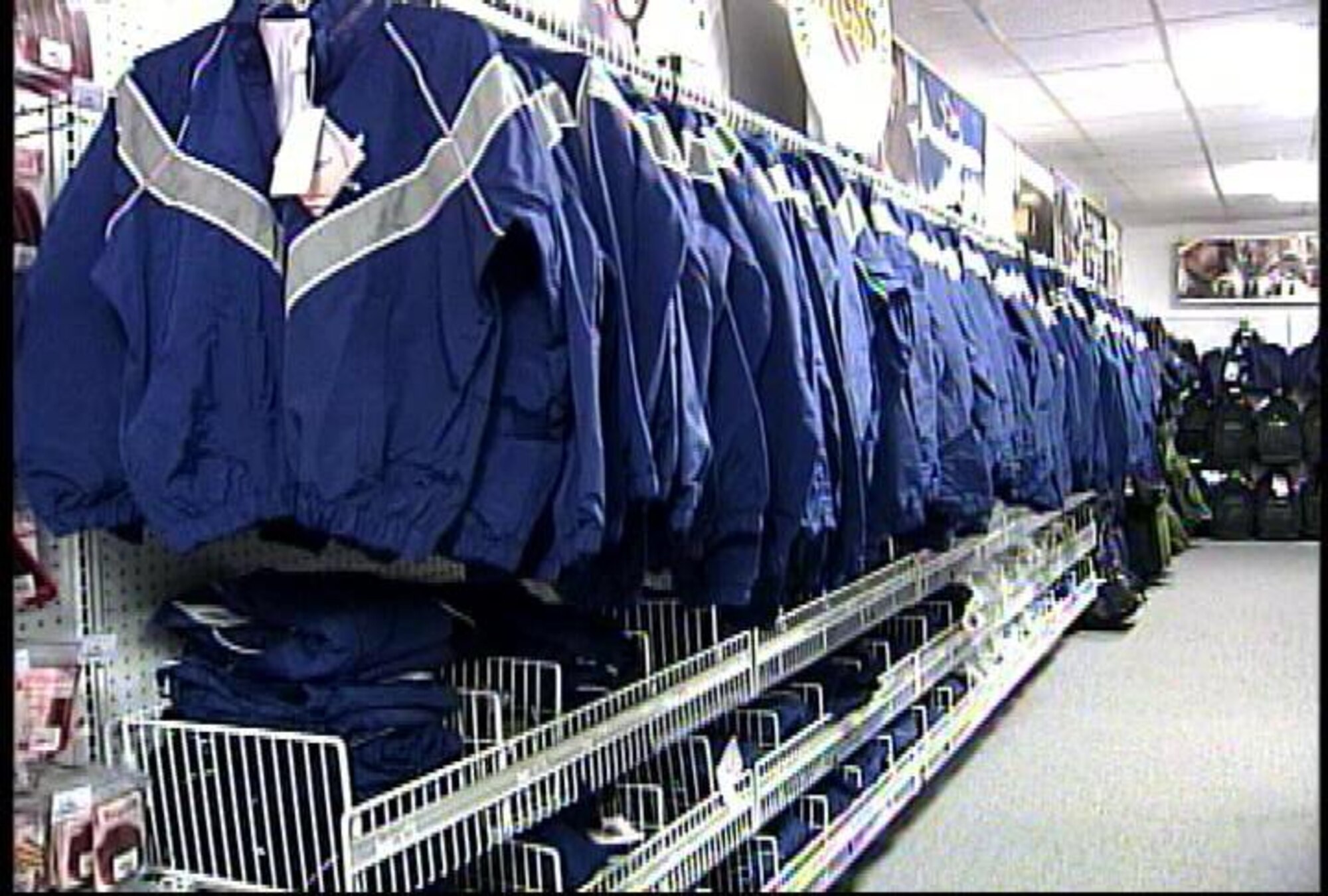 The Air Force will effect some uniform changes Oct. 1, and all Airmen must have their physical training uniforms -- like these on the rack at a military clothing sales store -- available that day. (U.S. Air Force photo)