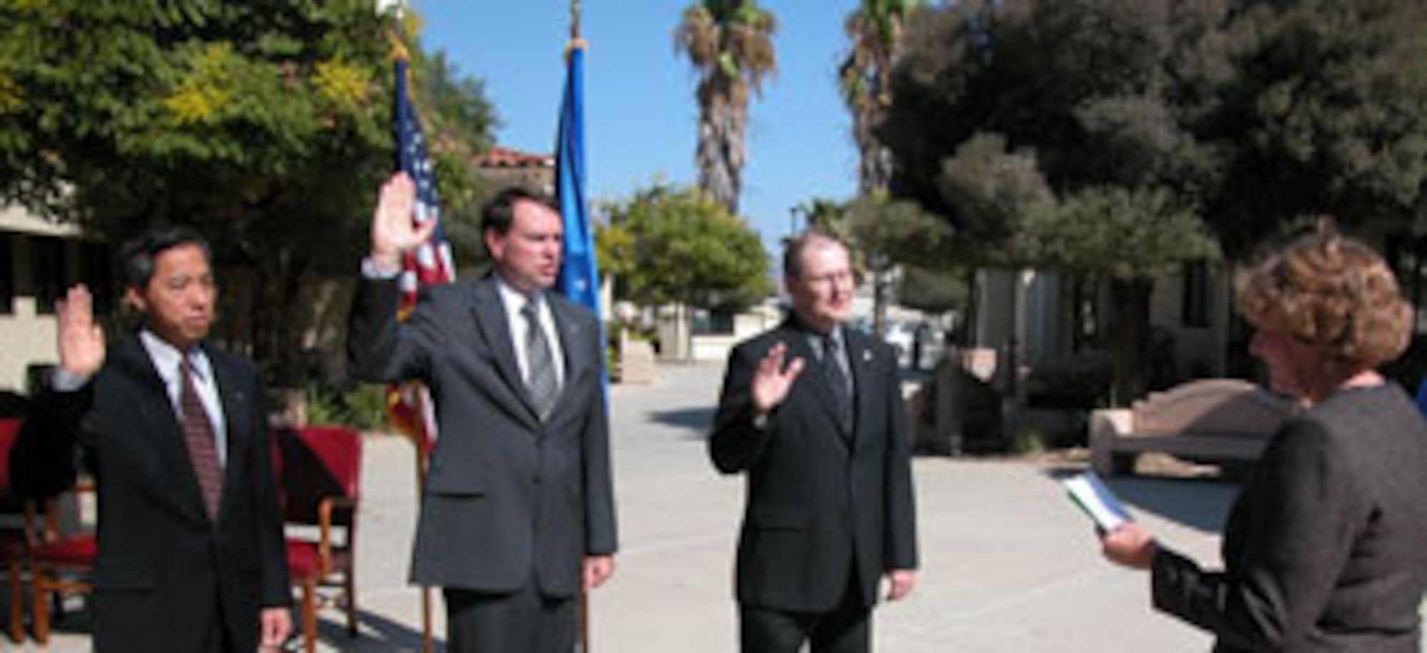Assistant Auditor General of the Air Force Ms. Judy Simon administers the oath of appointment to Mr. Derrick Wong, Mr. James Stahle and Mr. Ron Prentkiewicz, Air Force Audit Agency, March Air Reserve Base, Calif. All three were promoted to the rank of GS-15.  Ms. Simon promoted the local auditors to the highest GS grade during a recent ceremony at the base. (U.S. Air Force photo by Maj. Don Traud)