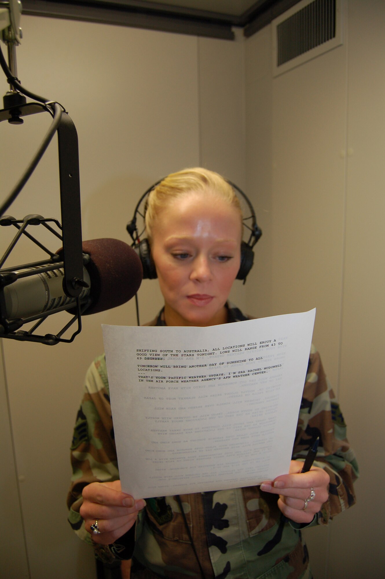Senior Airman Rachael McDowell reads weather forecasts as part of a two-minute weather spot for Air Force News Service overseas. Airman McDowell is a weather broadcast technician with the Air Force Weather Agency at Offutt Air Force Base, Neb. (U.S. Air Force photo/Staff Sgt. Shad Eidson)


