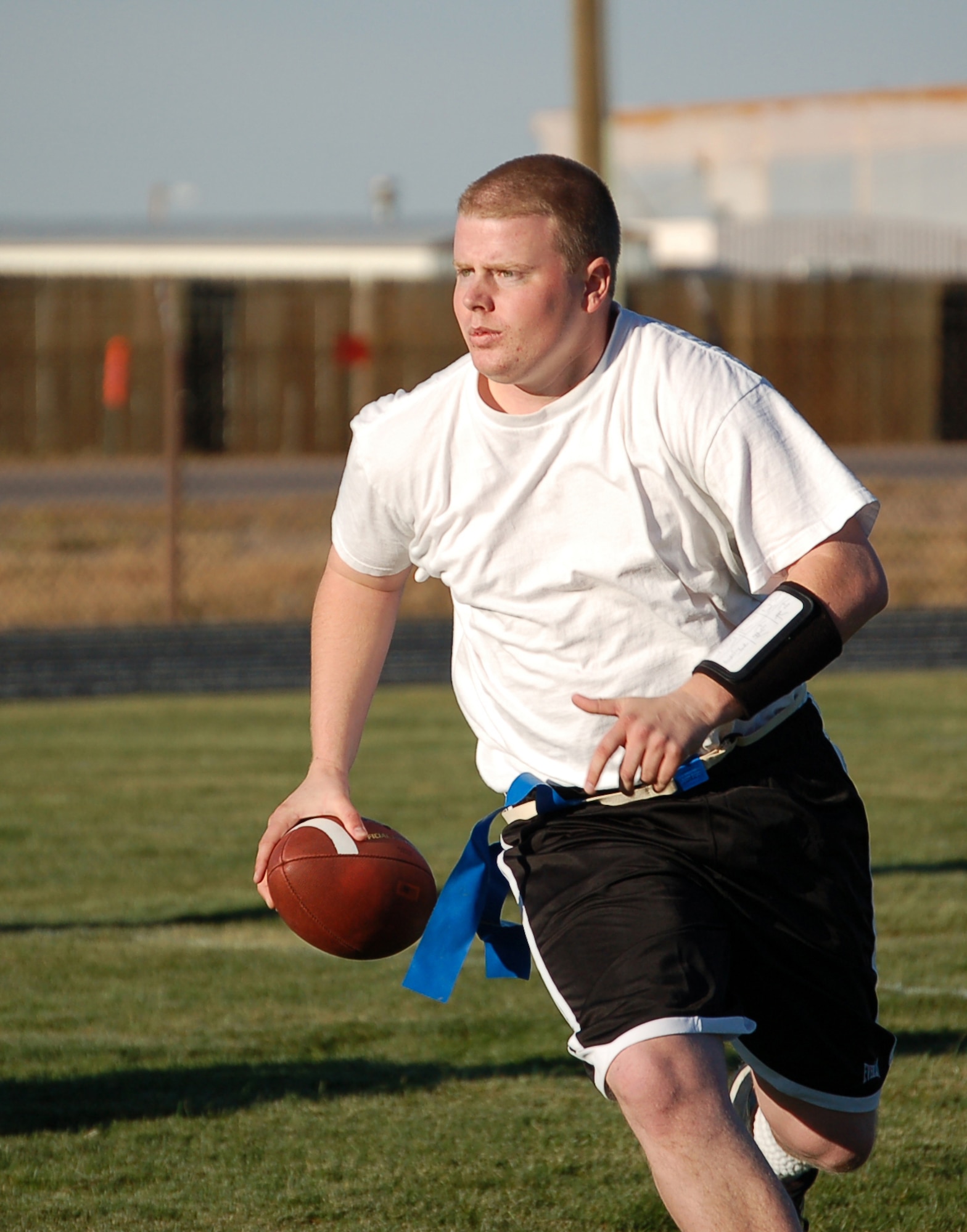 Josh Mills, quarterback for the 566th Information Operations Squadron's intramural flag football team, runs the ball during Tuesday's game. (U.S. Air Force photo by Senior Airman Jacque Lickteig)
