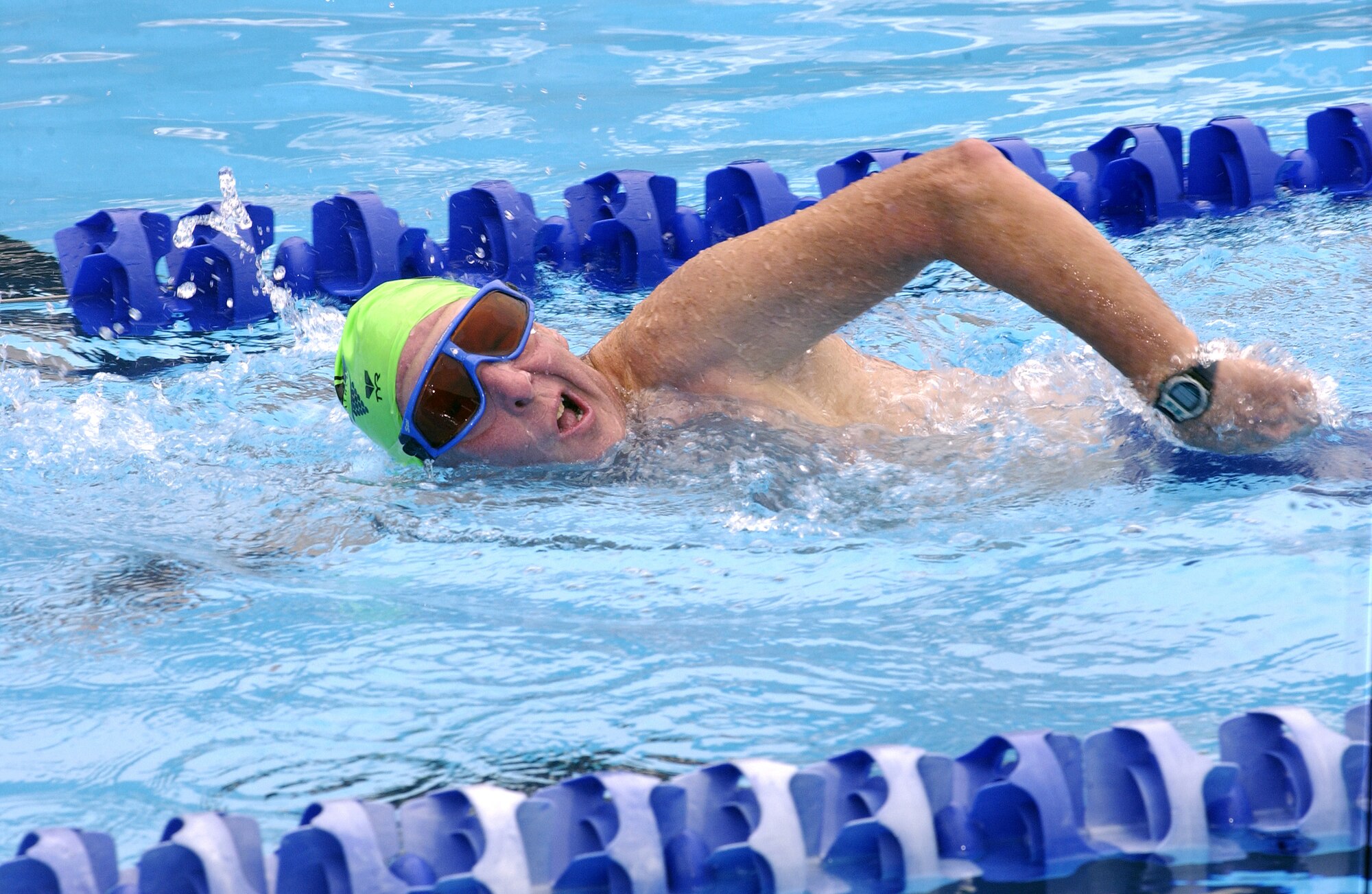 Ed Harris competes in the swimming portion of the Vandenberg Triathlon at the base pool.  Swimming was the first leg of the competition.  The triathlon consisted of swimming, bicycling and running events.