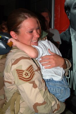 Tech. Sgt. Amanda Sebastian, a medical technician with the 433rd Aerospace Medicine Squadron gets a huge hug from her little nephew on her return from Balad. Sergeant Sebastian was one of four AMDS medical personnel to join about 30 members of the 433rd Aeromedical Staging Squadron when they voluntarily deployed to run the casualty staging facility at the Air Force Theater Hospital at Balad AB, Iraq for 120 days. At home in the 433rd  AMDS, Sergeant Sebastian is the assistant NCOIC of physical exams. (U.S. Air Force Photo/Master Sgt. Collen McGee)