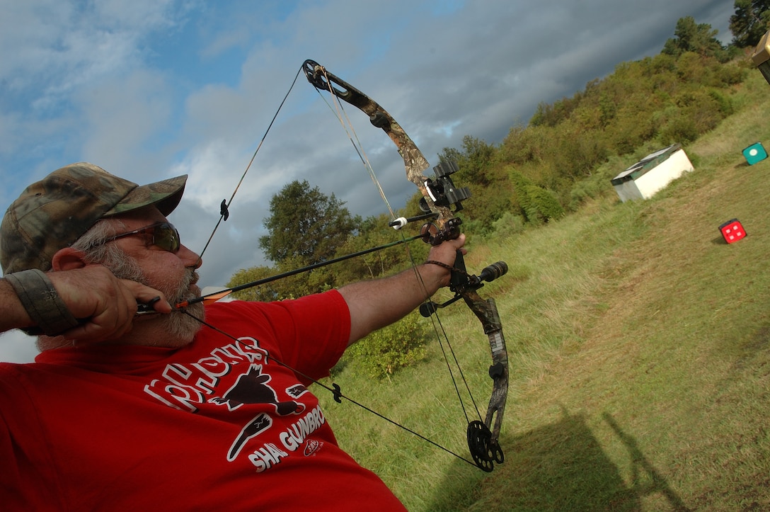 Retired Master Sgt. Rob Hardage aims at a target for the archery hunting qualification course near the Langley Combat Arms training area Sept. 16. Bow hunters wanting to hunt on Langley during the 2006-2007 season were required to attend the qualification course before being allowed to hunt on base. (Photo by Senior Airman DeLicha Germany)