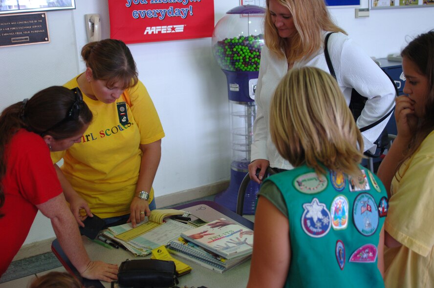 Patricia Presley, committee chairperson for Adana-Incirlik Neighborhood Girl Scouts, goes over the game plan for Girl Scout registration with volunteers at the Base Exchange Sept. 23. (U.S. Air Force photo by Airman 1st Class Nathan Lipscomb)