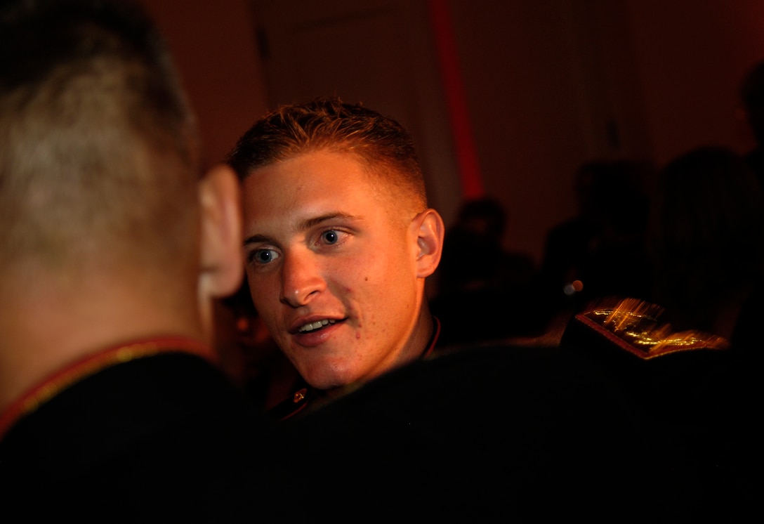 Marine Cpl. Robert Snyder, recipient of a USO Servicemember of the Year award, is greeted by the Chairman of the Joint Chiefs of Staff Marine Gen. Peter Pace during a reception at the 65th annual USO World Gala Sept 28 in Washington, D.C. Snyder's platoon encountered enemy fire while on patrol in Iraq, and his actions saved the lives of three Marines. Photo by Sgt. D. Myles Cullen, USAF