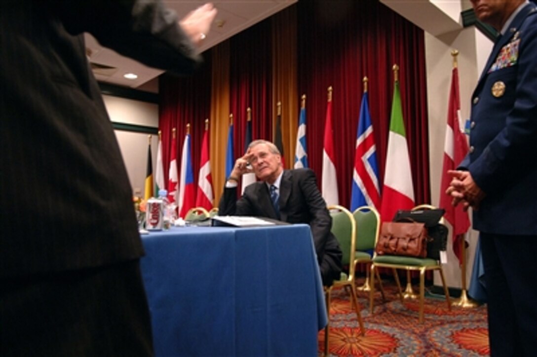 Defense Secretary Donald H. Rumsfeld consults with his staff in Portoroz, Slovenia, Sept. 28, 2006.  Rumsfeld is visiting Slovenia to attend the NATO Defense Ministerial meeting and conduct bilateral discussions with Slovenian leaders. 