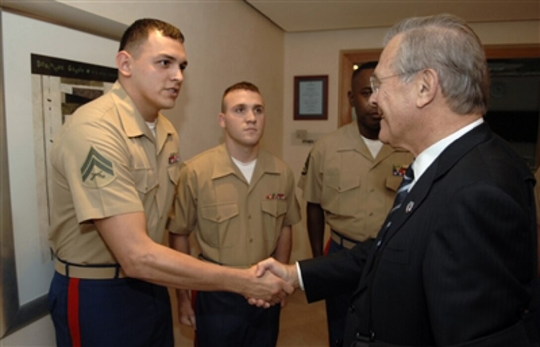 Defense Secretary Donald H. Rumsfeld meets with U.S. Marines in Tirana, Albania, Sept. 27, 2006. Rumsfeld was in Albania to attend the Southeast Europe Defense Ministerial Process meeting and encourage Albania's continuing efforts to join NATO.
