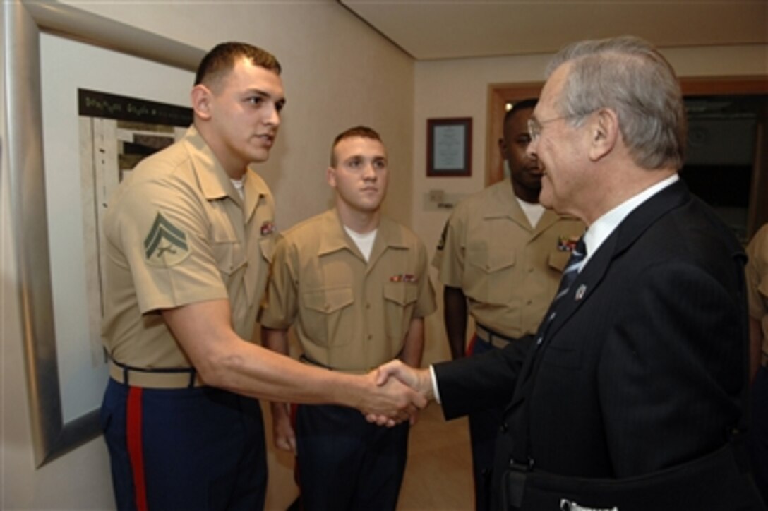 Secretary of Defense Donald H. Rumsfeld (right) meets with U.S. Marines in Tirana, Albania, on Sept. 27, 2006.  Rumsfeld is in Albania to attend the Southeast Europe Defense Ministerial Process meeting and to thank Albanian troops for their performance in Iraq and Afghanistan.  