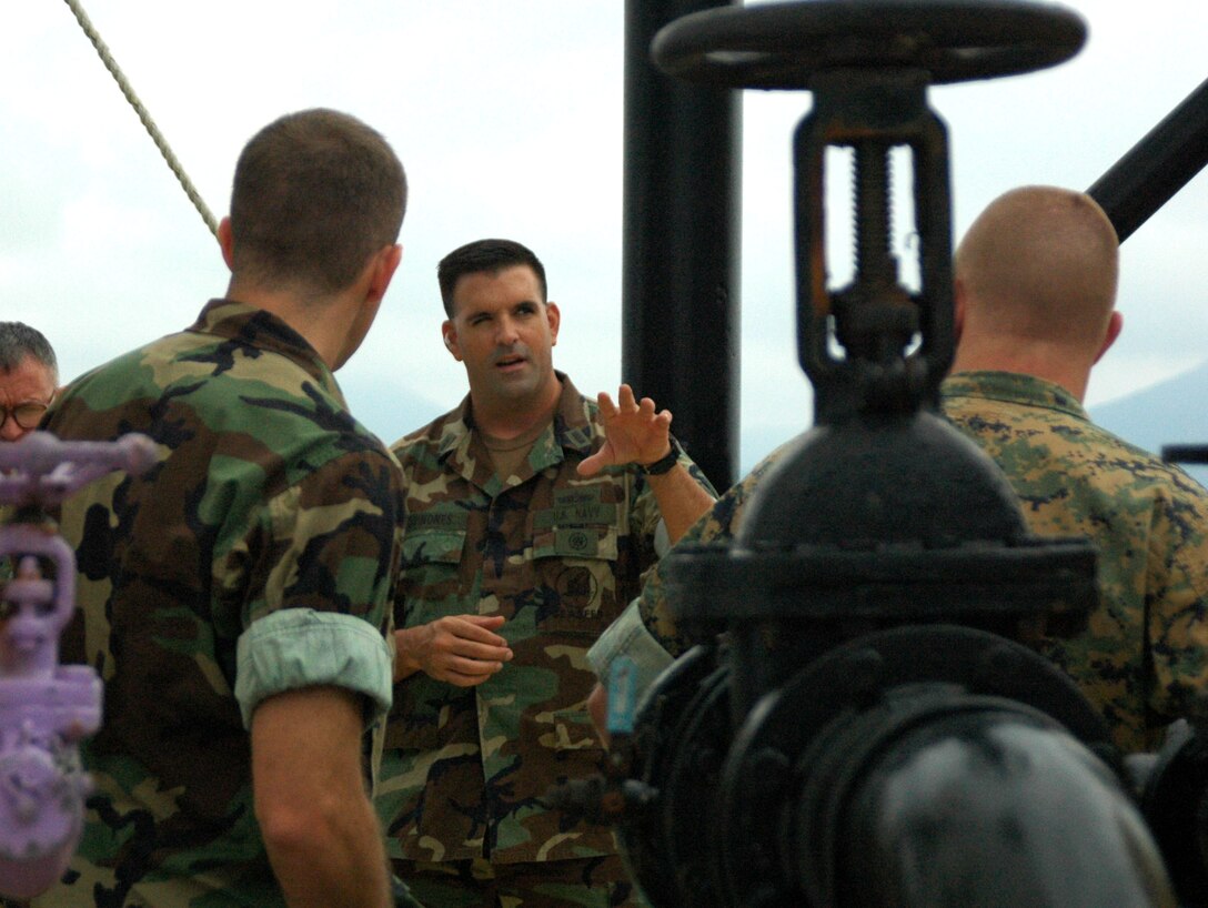 TOULON, France ? Maritime Prepositioning Force officer  Lt. j.g. Edward D. Quinones, from Amphibious Construction Battalion Two, from Little Creek, Va., gives a tour of the MPF ship, MV 2nd LT John P. Bobo, positioned off the southern coast of France.  The ship was host to approximately 60 MPF Marines from around the fleet for Exercise Brilliant Midas 06.  The exercise took place Sept. 28 to Oct. 14, and served as a learning tool to maintain and increase staff planning skills for MPF Marines. The force includes 16 constantly deployed ships that are configured to transport nearly everything the Marine Corps needs to sustain about 15,000 Marine Corps Air Ground Task Force personnel for up to 30 days during an initial military operation.