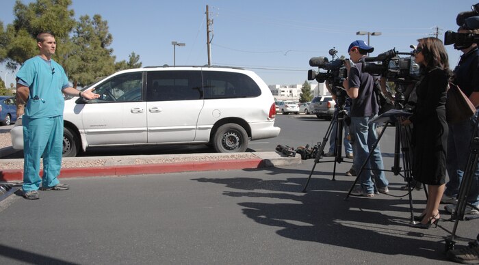 Staff Sergeant Lopaka Mounts (left), a pararescueman from the 58th Rescue Squadron talks with reporters from local news agencies about hands on training along side the University Medical Center medical staff March 30.
(U.S Air Force Photo/Senior Airman Larry E. Reid Jr.)
