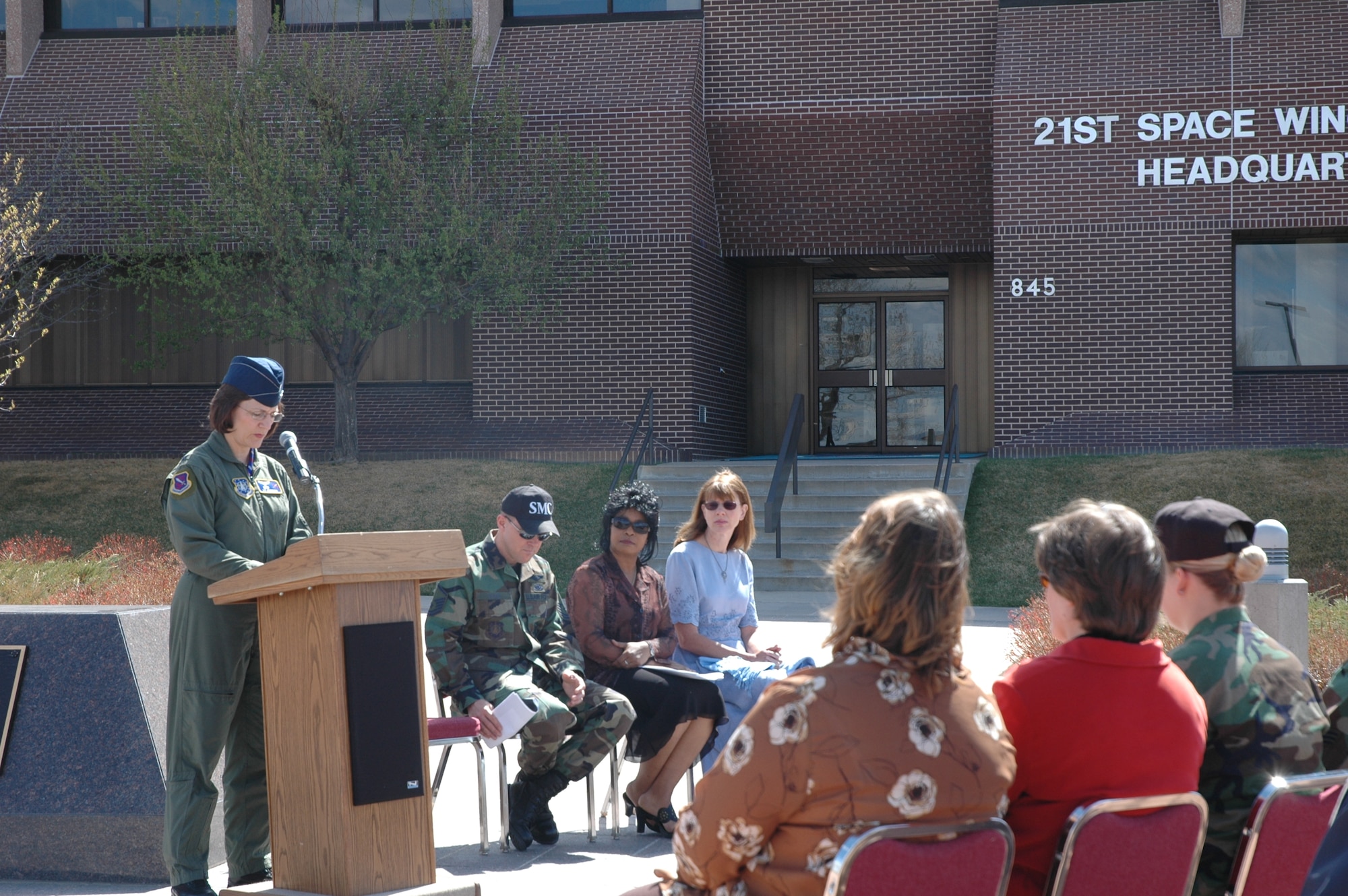 Col. Liz Anderson, individual mobilization augmentee to the 21st Space Wing commander, reads a proclamation recognizing April as Sexual Assault Awareness Month at 11:30 a.m. April 2 in front of the 21st Space Wing Headquarters building. The proclamation began a series of Sexual Assault Awareness Month activities designed to raise awareness. Other activities planned include a "Full Power" interactive workshop on self-defense from 11 a.m. to 1 p.m. April 11 in the Building 350 atrium, and a Sexual Assault Awareness Fun Run at 11 a.m. April 20 at the fitness center. For information, call 556-7272. (U.S. Air Force Photo/Staff Sgt. Jessica Switzer)