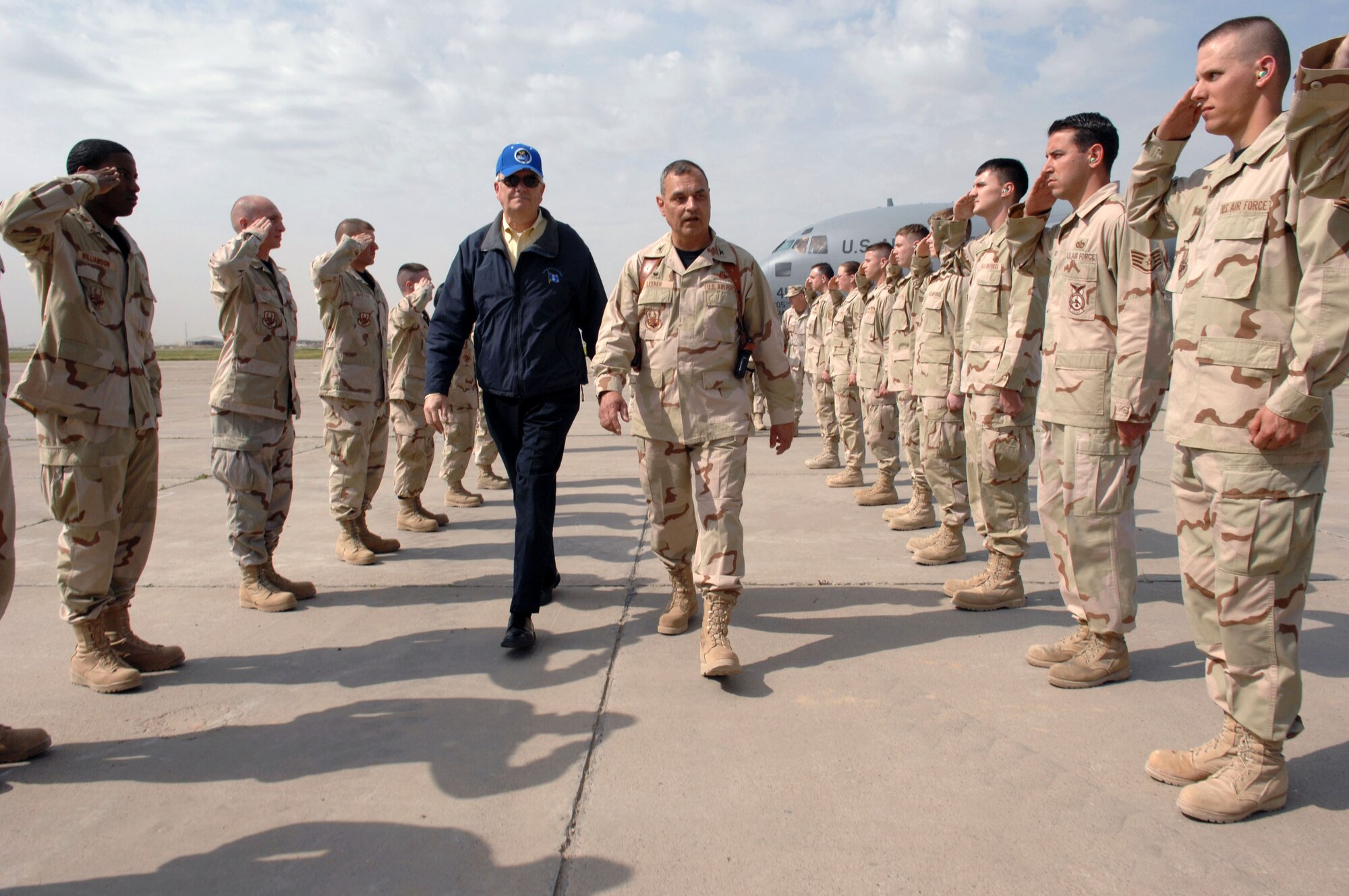 Secretary of the Air Force Michael W. Wynne meets with Col. Robert Leeker, the 506th Air Expeditionary Group commander, March 28 at Kirkuk Regional Air Base in Iraq. Airmen of the 506th Air Expeditionary Group salute the visiting SECAF. (U.S. Air Force photo/Senior Airman Bradley A. Lail)