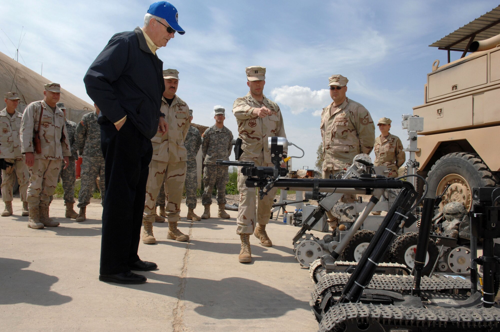 Capt. Joshua Tyler, the explosive ordnance disposal flight commander, explains to the Secretary of the Air Force, Michael W. Wynne, March 28, how explosives are retrieved once discovered at Kirkuk Air Base in Iraq. (U.S. Air Force photo/Senior Airman Bradley A. Lail) 
