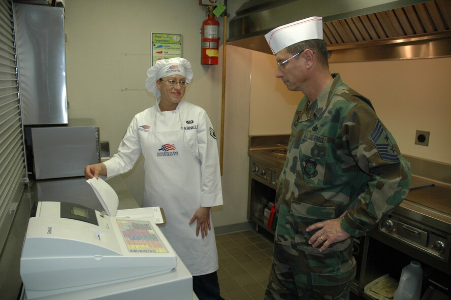 MINOT AIR FORCE BASE, N.D. – Staff Sgt. Michelle Darnell, a 742nd Missile Squadron chef, explains her daily responsibilities to Chief Master Sgt. Frank Smith, 20th Air Force command chief, during his visit to Missile Alert Facility Delta-01 March 28. During his visit here from March 27 to 30, Chief Smith stressed training, education and the importance of a winning attitude. (U.S. Air Force photo by Airman 1st Class Wesley Wright)