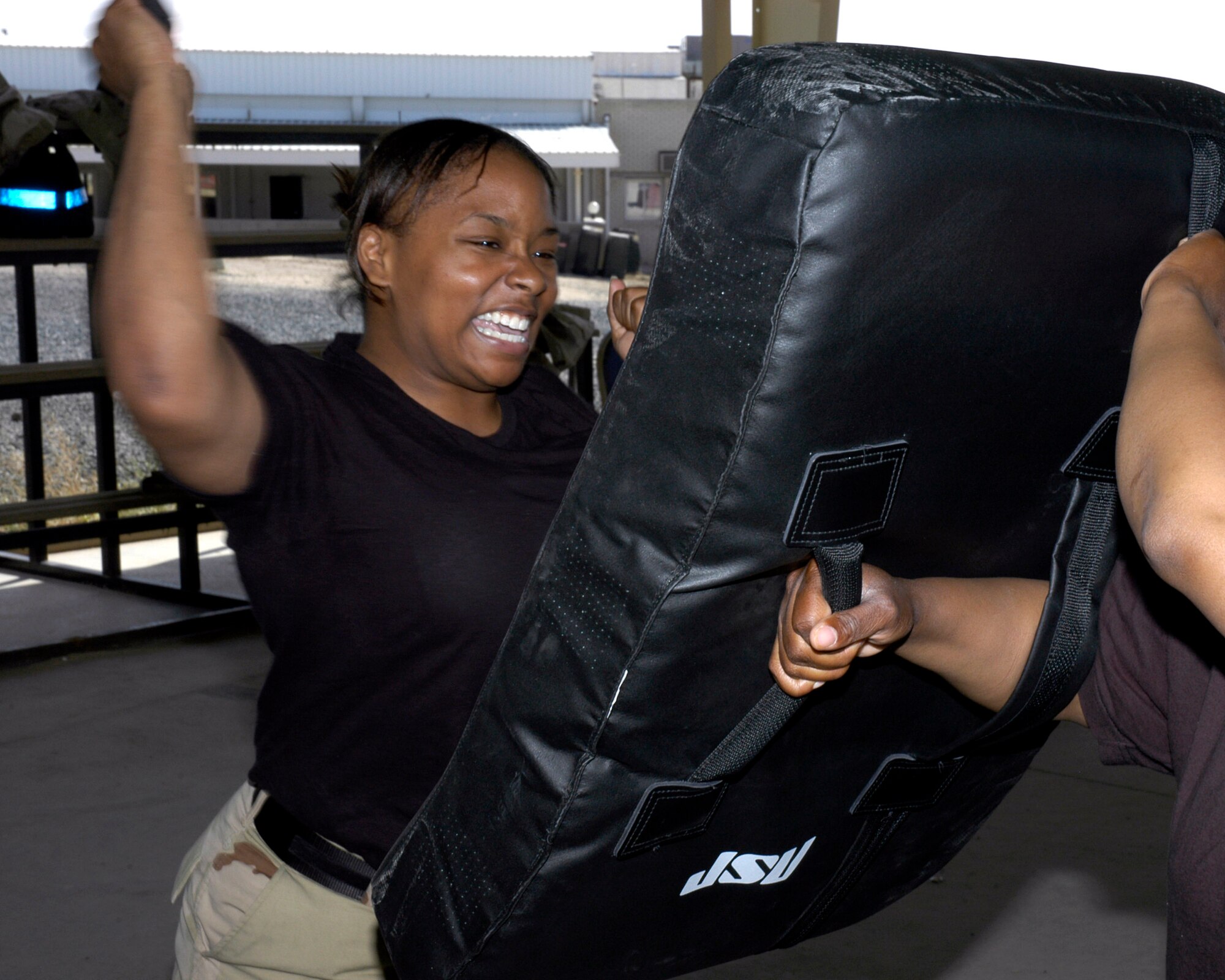 Airman 1st Class Deloric Harrison, a force protection member with the 386th Air Expeditionary Wing, takes part in a personal defense class March 30 in Southwest Asia.  All 386th AEW force protection personnel are trained in the use of the ASP, an extending baton used by police and security forces. (U.S. Air Force photo/Staff Sgt. Ian Carrier)                        