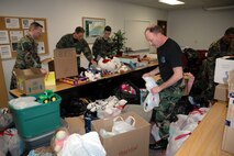MINOT AIR FORCE BASE, N.D. – Team Minot members organize donations at the community center here March 29. As part of an initiative from the 20th Air Force command chief, organizations within 20th AF have been collecting children’s items from teddy bears to shoes to help support Iraqi orphans. (U.S. Air Force photo by Airman 1st Class Wesley Wright)