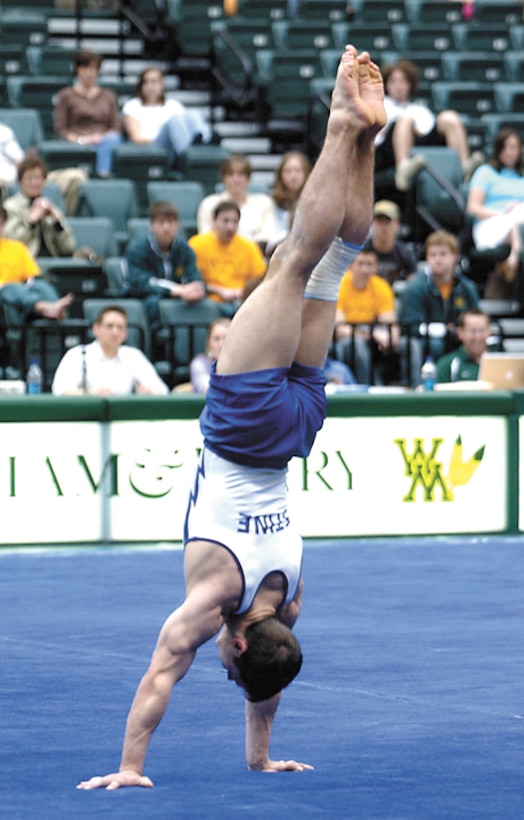Air Force Academy junior Greg Stine placed first in the floor exercise during the United States of America Gymnastics championships held March 25 at the College of Wililam & Mary in Williamsburg, Va. He also won the still rings and the All-Around title March 24. (Military Newspapers of Virginia photo/Harry Gerwien)