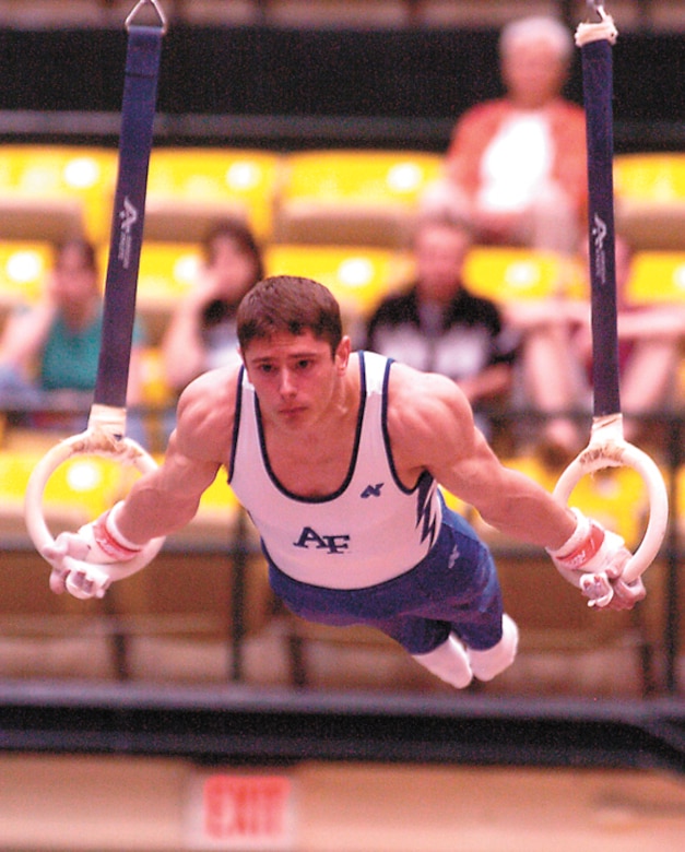 Air Force Academy junior Greg Stine demonstrates concentration, balance and muscle control during his time on the rings during the United States of America Gymnastics championships held at the College of Wililam & Mary in Williamsburg, Va., March 24 and 25. Stine won the event March 25. (Military Newspapers of Virginia photo/Harry Gerwien)