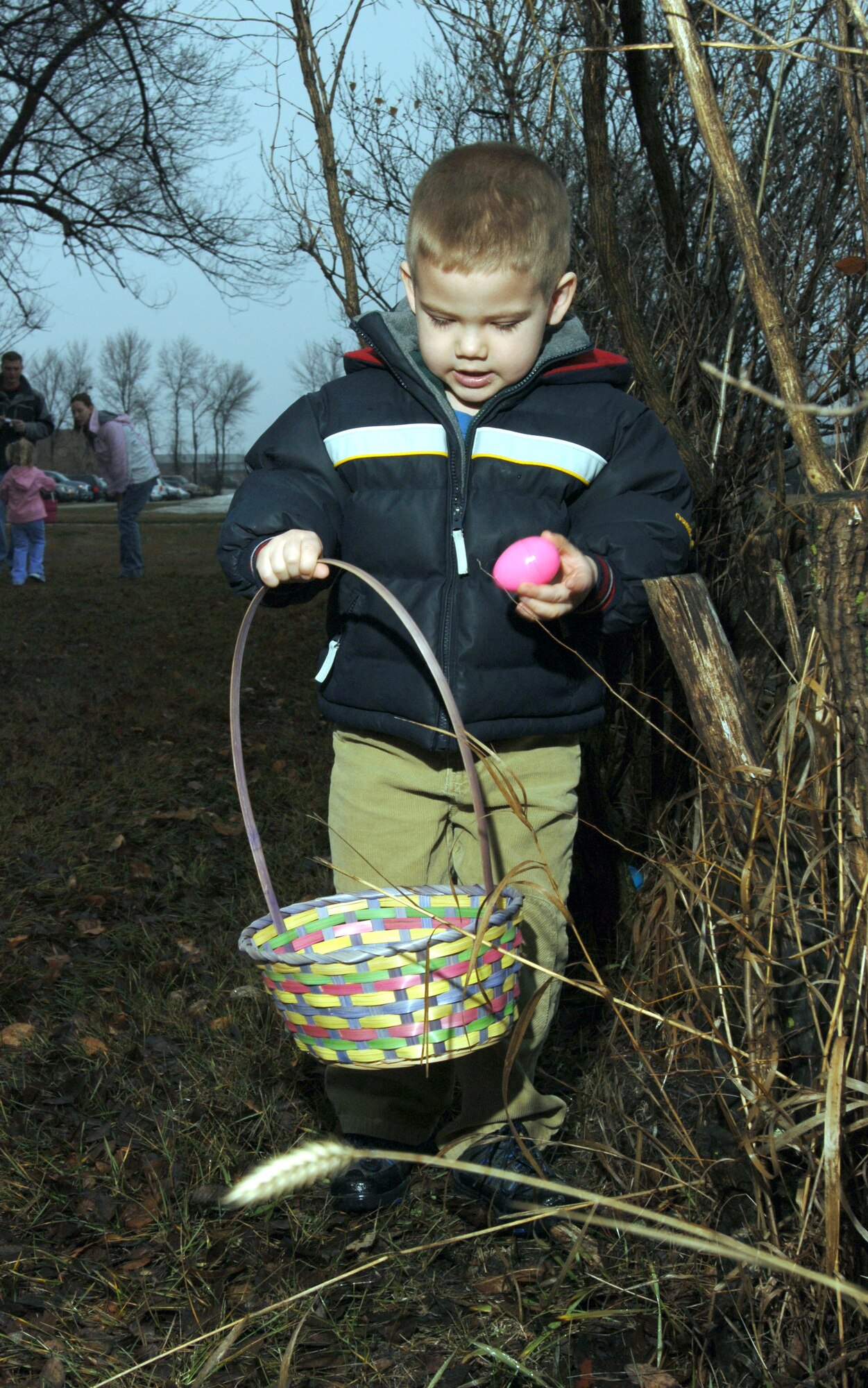 GRAND FORKS Air Force Base, N.D.-- Daivn Sutton, son of Staff Sgt. Christopher Sutton, 319th Logistics Readiness Squadron, fills his Easter basket during an Easter egg hunt here March 31.  (US Air Force photo/Staff Sgt. Suellyn Nuckolls)
