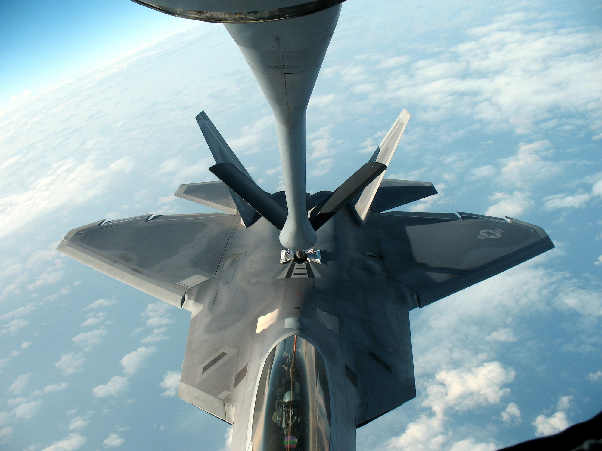 A KC-135 Stratotanker refuels an F-22 Rapter over the Pacific. (U.S. Air Force photo)
