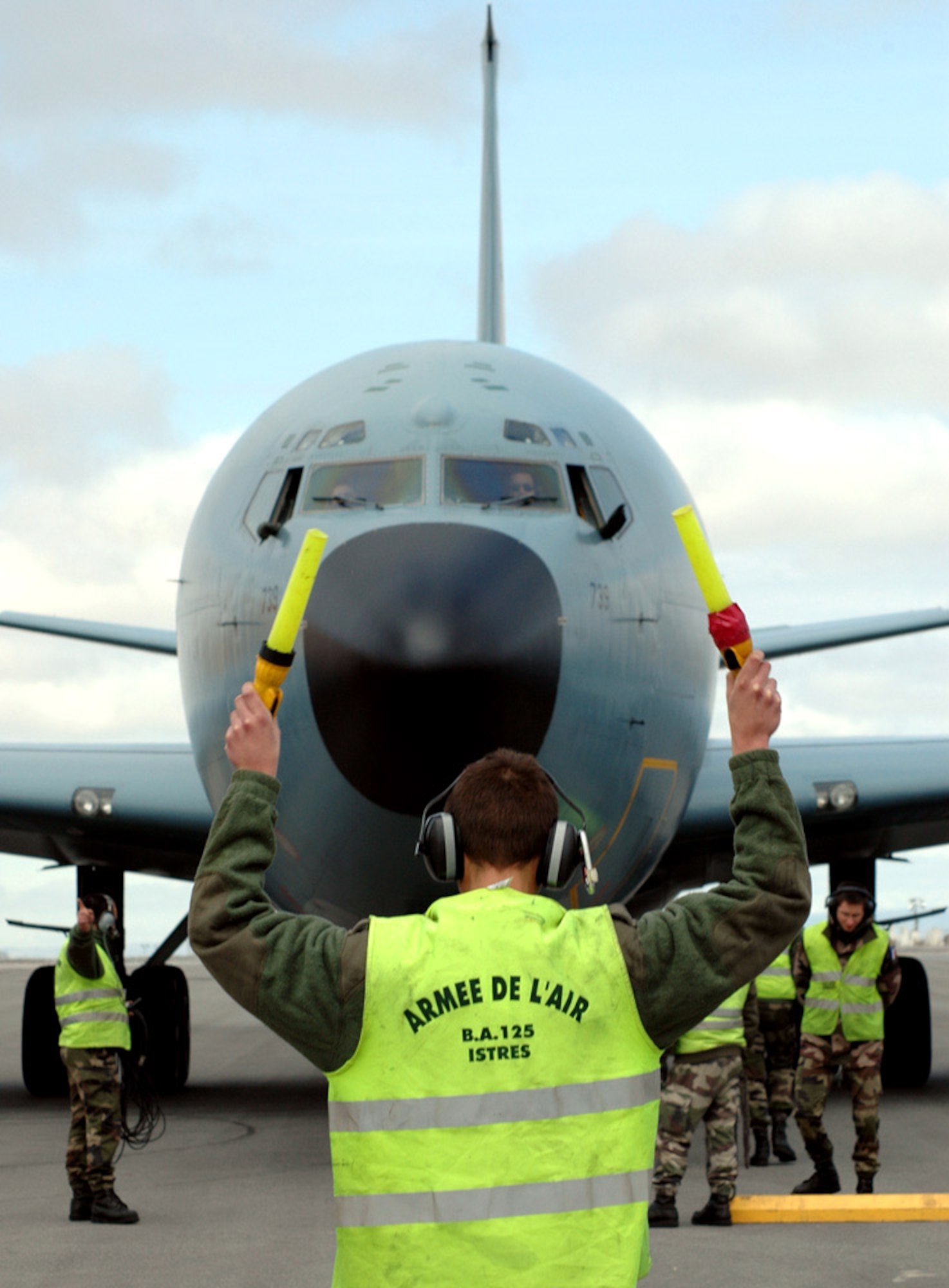 French coalition 'Les Pistards,' or ground crew, marshall in a C-135FR refueler at Manas Air Base, Kyrgyzstan. The Flight Refueling Group 93 "Bretagne" refuels coalition aircraft taking part in Operation Enduring Freedom including F-18 Hornets, A-10/OA-10 Thunderbolt IIs and F-16 Fighting Falcons. (U.S. Air Force photo/Master Sgt. Daniel Nathaniel)