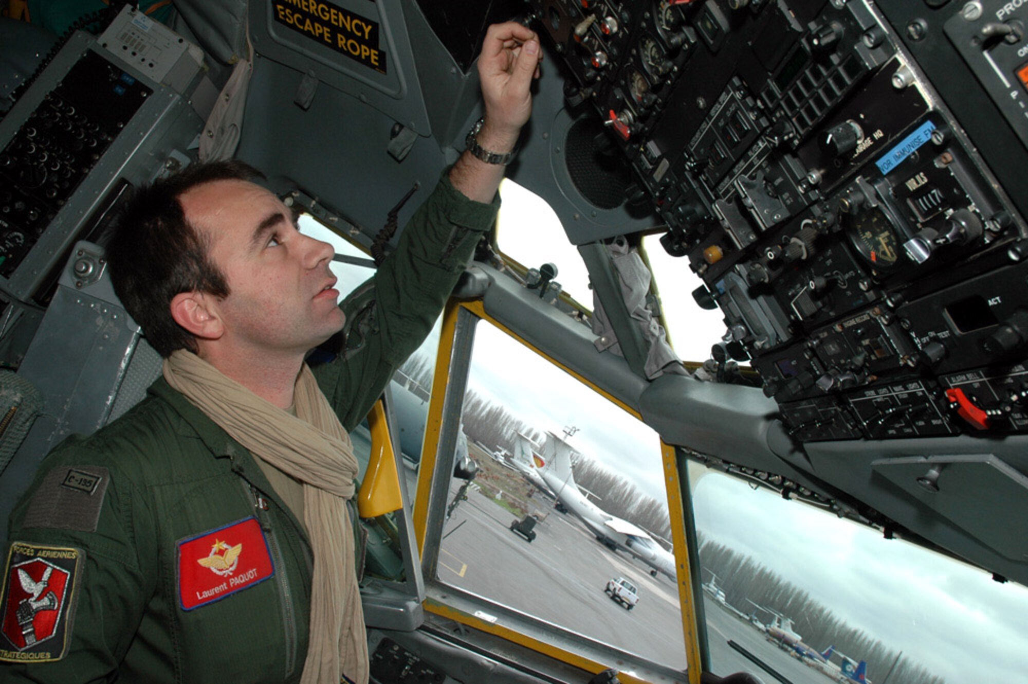 Maj. Laurent Paquot, the French coalition detachment commander, at the controls of the C-135FR after a landing at Manas Air Base, Kyrgyzstan. The Flight Refueling Group 93 "Bretagne" refuels coalition aircraft taking part in Operation Enduring Freedom including F-18 Hornets, A-10/OA-10 Thunderbolt IIs and F-16 Fighting Falcons. (U.S. Air Force photo/Master Sgt. Daniel Nathaniel) 
