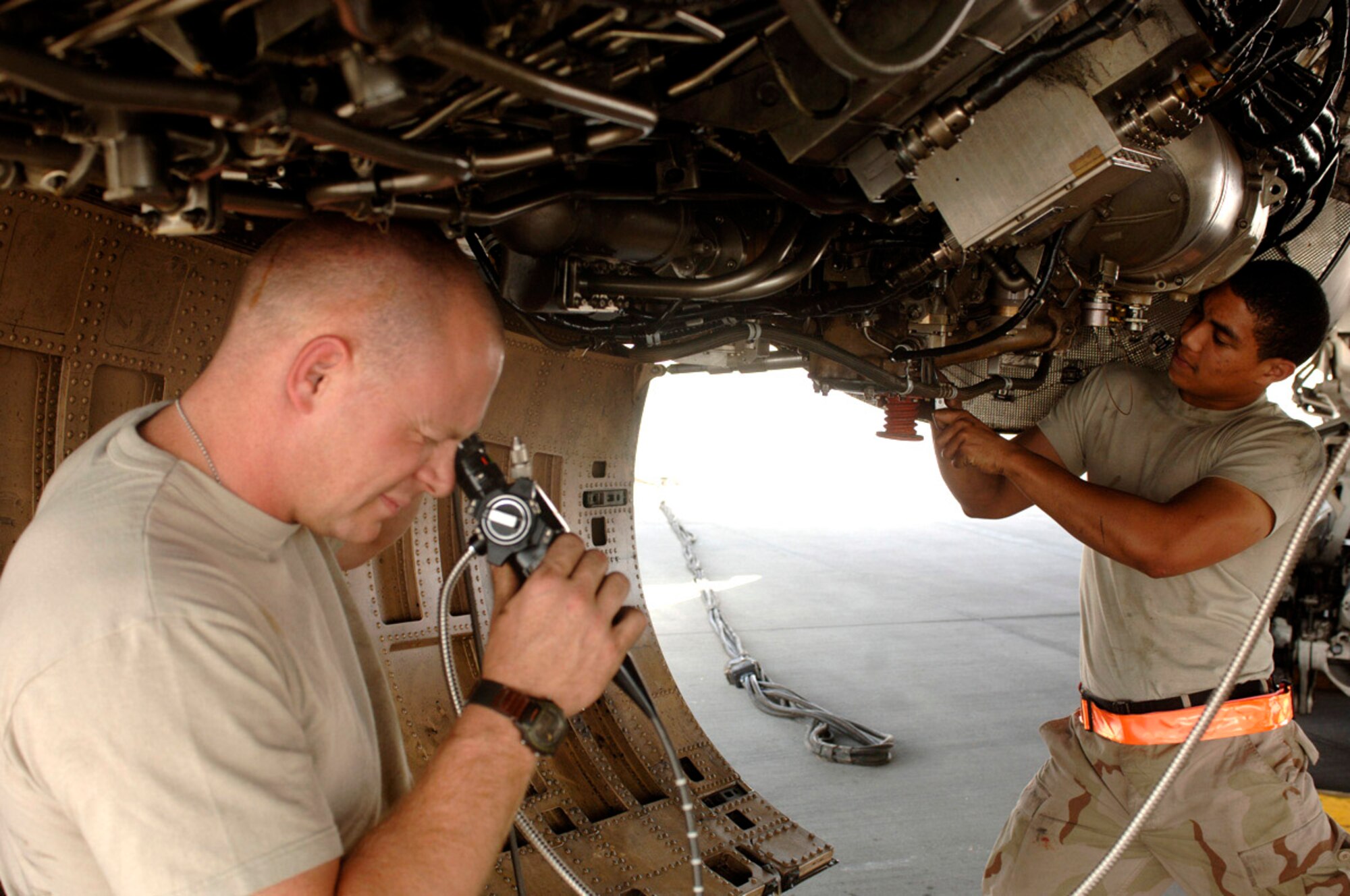 Jet engine technicians, Staff Sgt. Shaun Bennet (left) and Senior Airman Maurice Williams, inspect a B-1B Lancer's internal compressor blades during an engine borescope inspection. This inspection is accomplished every 100 engine operating hours. The Airmen are assigned to the  379th Expeditionary Aircraft Maintenance Squadron's 34th Aircraft Maintenance Unit in support of Operation Iraqi Freedom and Operation Enduring Freedom in Afghanistan. (U.S. Air Force photo/Staff Sgt. David Miller)