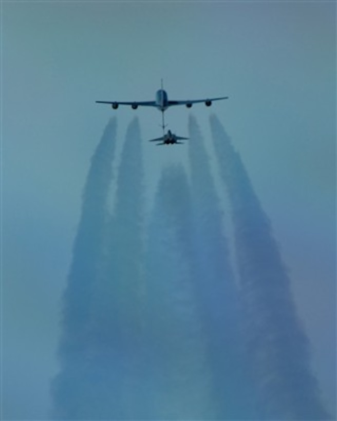 A U.S. Air Force F-15 Eagle refuels behind a KC-135 Stratotanker over the Pacific Alaska Range Complex on March 26, 2007.  The Eagle is attached to the 12th Fighter Squadron out of Elmendorf Air Force Base, Alaska, while the Stratotanker is attached to the 168th Air Refueling Squadron.  The Stratotanker also provides aerial refueling support to Navy and Marine Corps aircraft as well as aircraft of allied nations.  