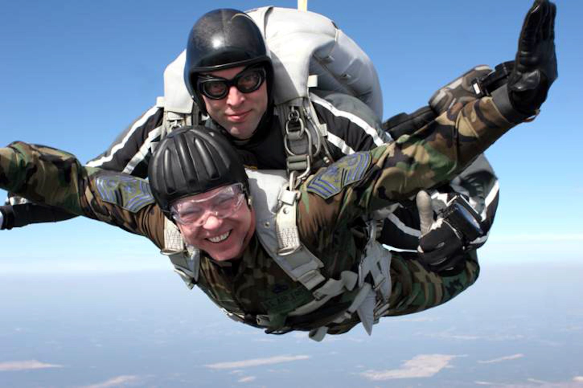Chief Master Sgt. Of the Air Force Rodney J. McKinley soars high above North Carolina during a tandem parachute jump with a member of the 24th Special Tactics Squadron from Pope Air Force Base, N.C.   The rare opportunity to jump with special tactics Airmen took place when Chief McKinley was accompanying Chief Master Sgt. Michael Gilbert, command chief of Air Force Special Operations Command, on a recent tour of AFSOC units.  Special tactics Airmen - combat controllers, pararescuemen and special operations weathermen ? work with special operators from all services on missions deep in enemy territory.  Their expertise includes conducting personnel recovery missions, collecting intelligence and providing terminal guidance for air attacks against valuable enemy targets.  They also generate high fidelity, localized, mission tailored weather forecasts for the ingress, employment, and egress of air, land and sea forces.  (Courtesy photo)

