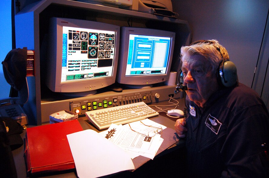 Retired Col. Terry Cawley, T-6A Simulator instructor for Lear Siegler Services, Inc., observes his last student March 16, at the T-6 flight simulator facility at Moody AFB. Colonel Cawley served 28 years in the Air force before becoming a T-6A simulator instructor. Moody’s last T-6A Texan Undergraduate Pilot Training course ends March 30. (U.S. Air Force photo by Tech.Sgt. Parker Gyokeres) 