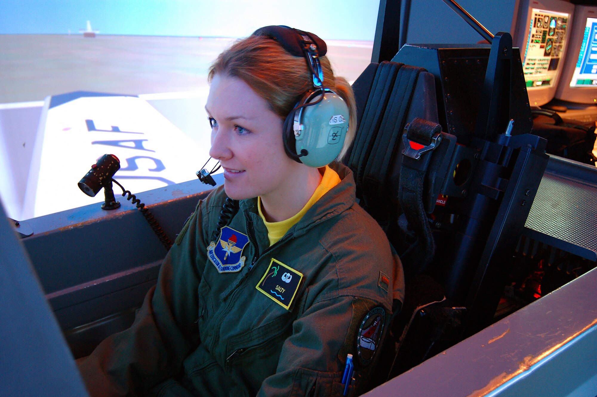 2nd Lt. Krissi Gage, 3rd Flying Training Squadron undergraduate student pilot, flies the last of more than 55,000 T-6A simulated student sorties at Moody AFB. Her instructor, retired Col. Terry Cawley, also taught the very first T-6A simulator flight in 2001. Moody’s last T-6A UPT course ends March 30. (U.S. Air Force photo by Tech.Sgt. Parker Gyokeres)