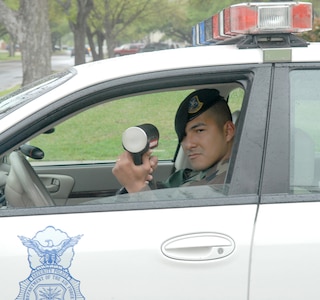 Staff Sgt. Jesus Duque, 12th Security Forces Squadron, conducts a radar selective as part of his law enforcement duties. (U.S. Air Force photo by Rich McFadden)