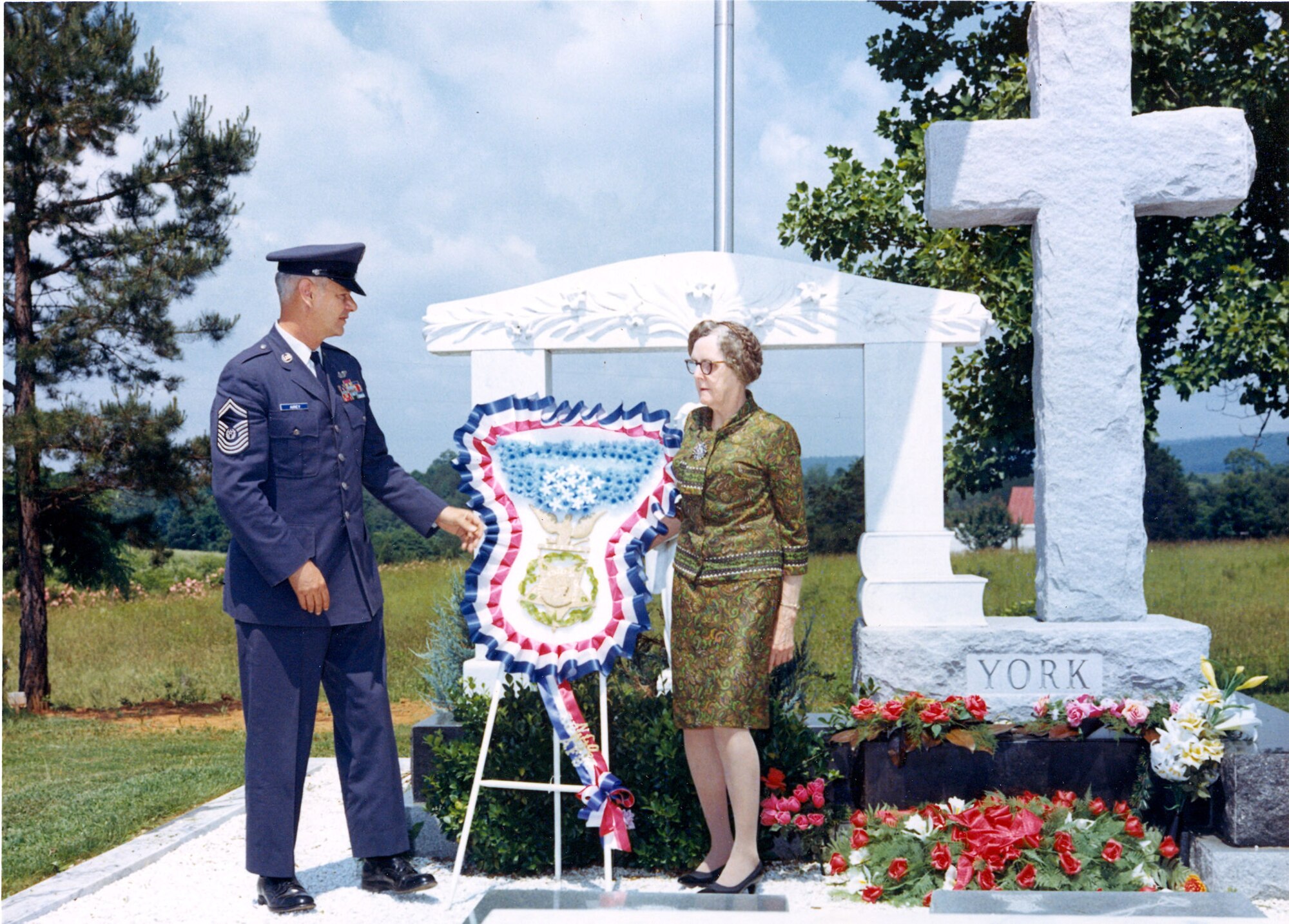 Chief Master Sergeant of the Air Force Paul Airey meets Mrs. Alvin C. York and places wreath on her husband's grave site during ceremonies honoring the World War I hero.  Chief Airey was selected as the first chief master sergeant of the Air Force on April 3, 1967.  During his tenure he visited many bases and talked with many Airmen about improving conditions for the enlisted force.  (U.S. Air Force file photo)