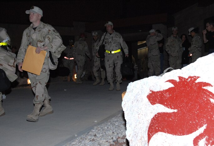 Members of the United States Air Force 555th RED HORSE Squadron, prepare to deploy after a big going away party with friends, family and team Nellis members 
(U.S Air Force Photo/Senior Airman Larry E. Reid Jr.) 